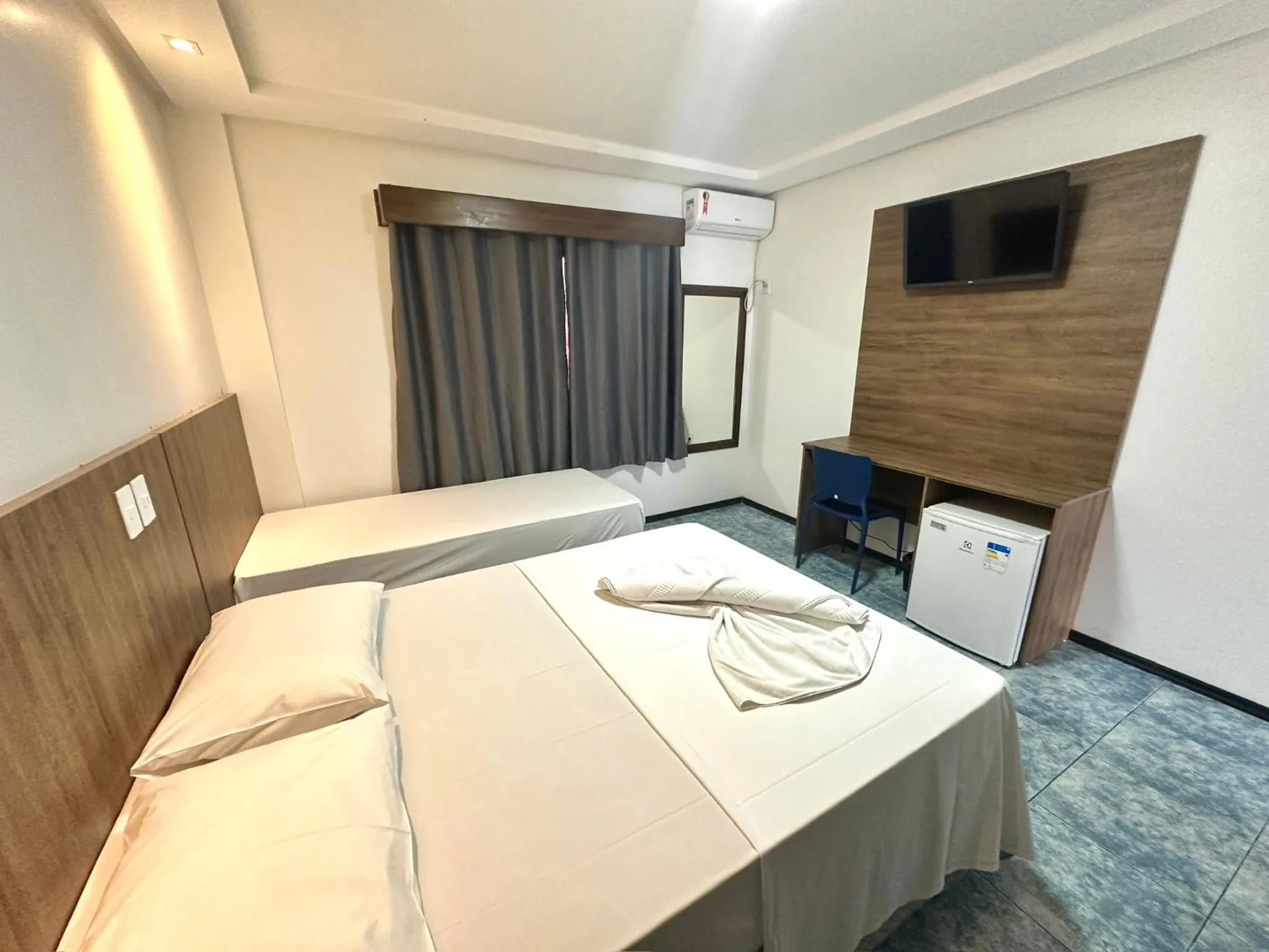 Bed in Hotel Bem Brasil