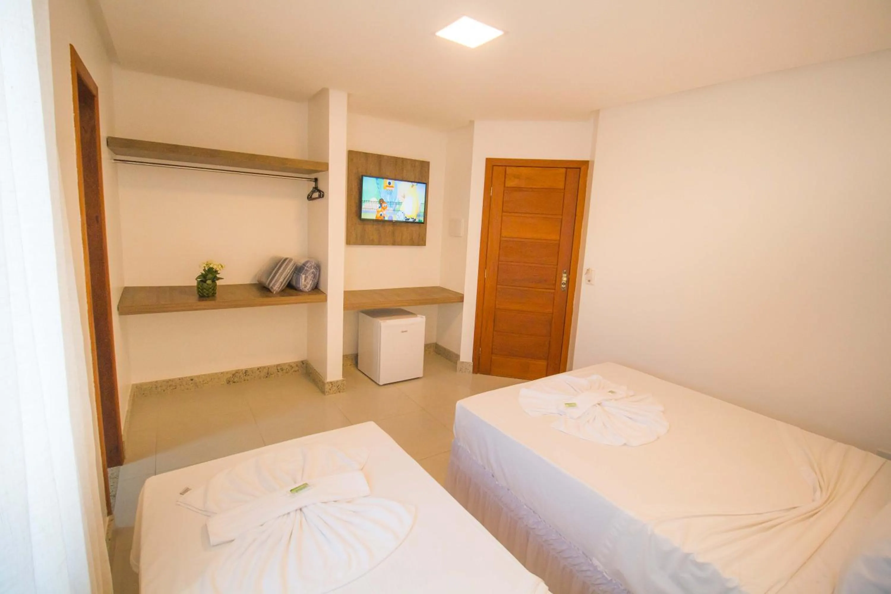 Bed in Hotel Bem Brasil