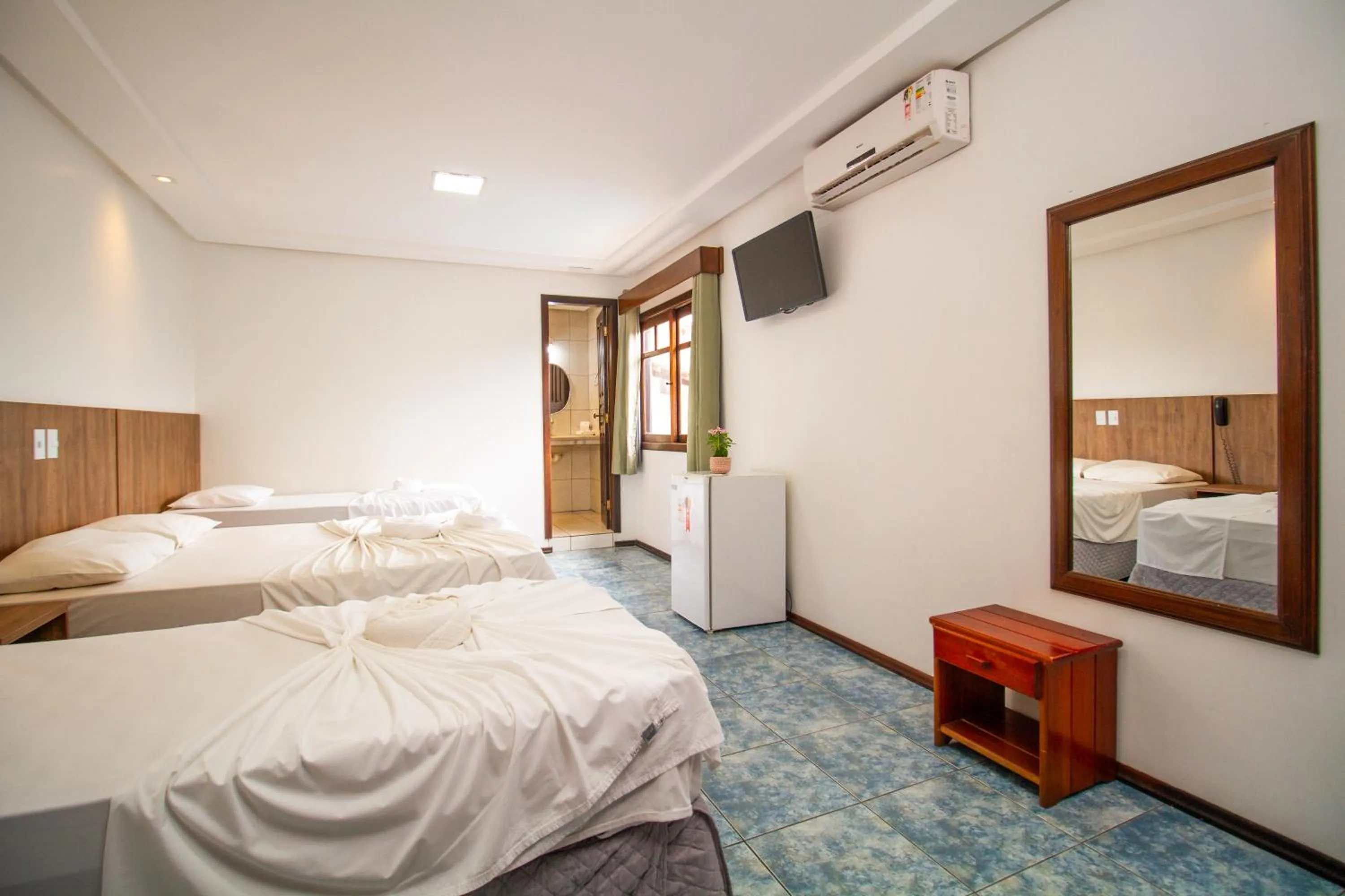 Bed in Hotel Bem Brasil