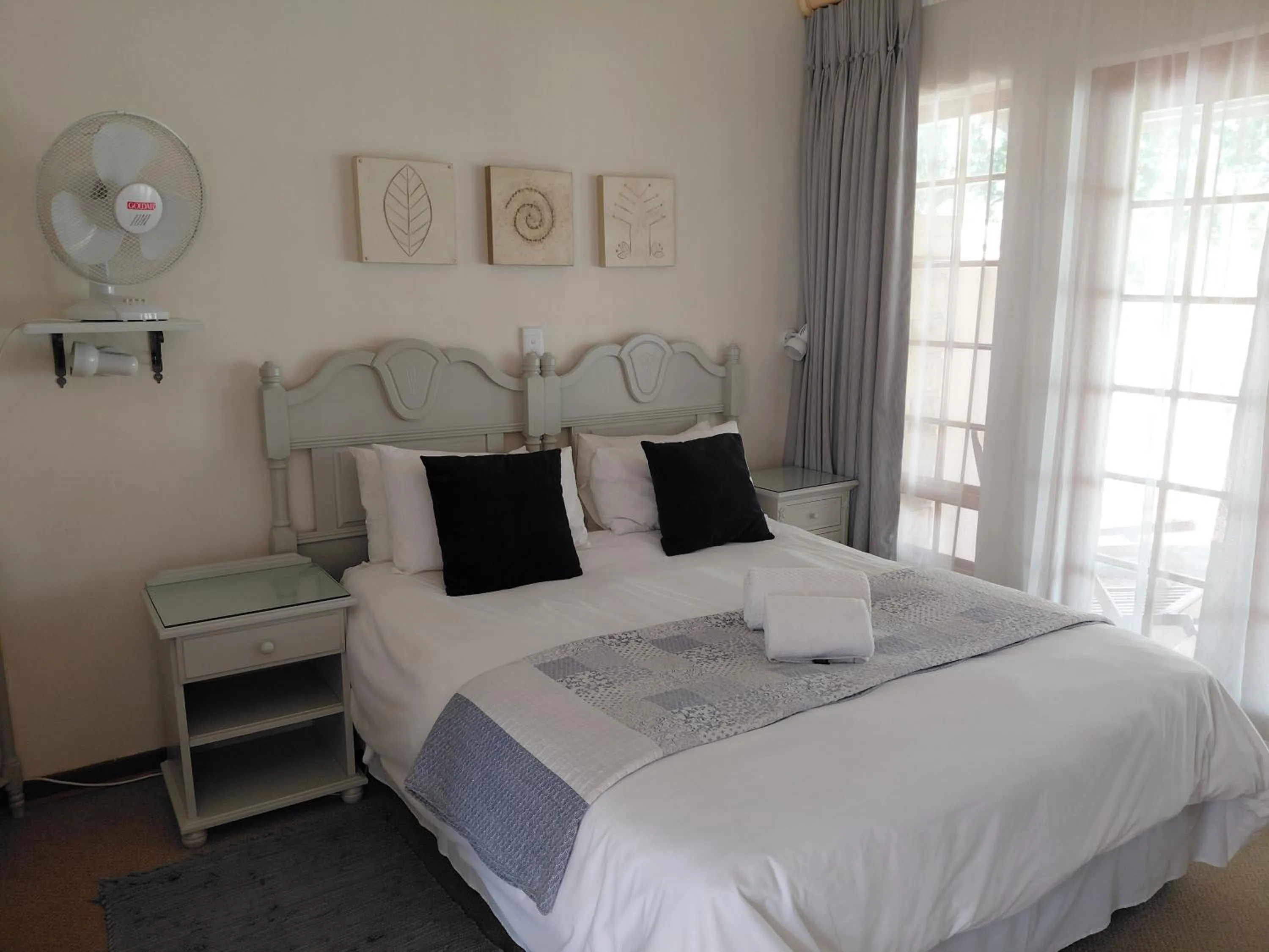 Bed in Sandstone Chameleon Guest House