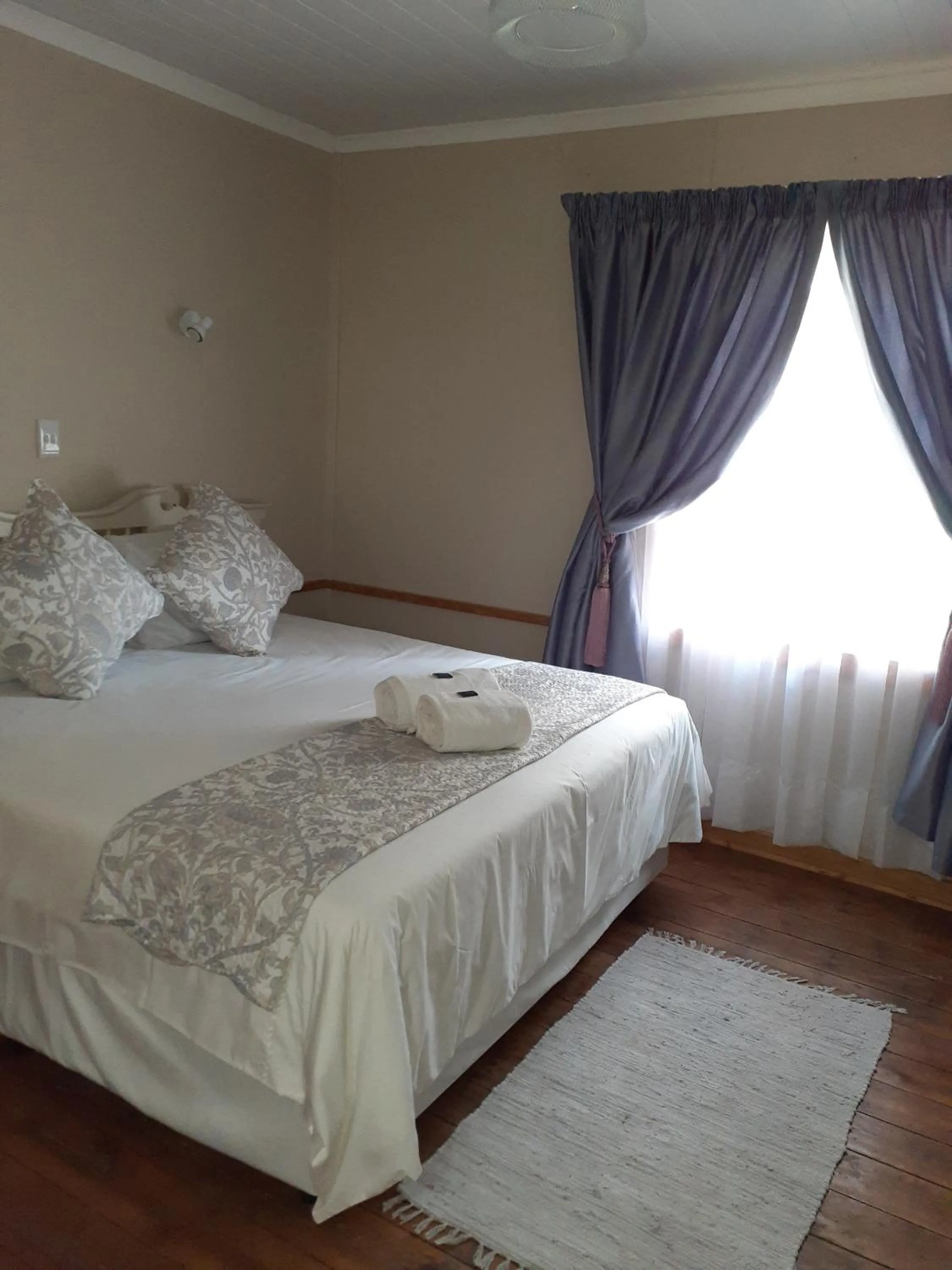 Bed in Sandstone Chameleon Guest House