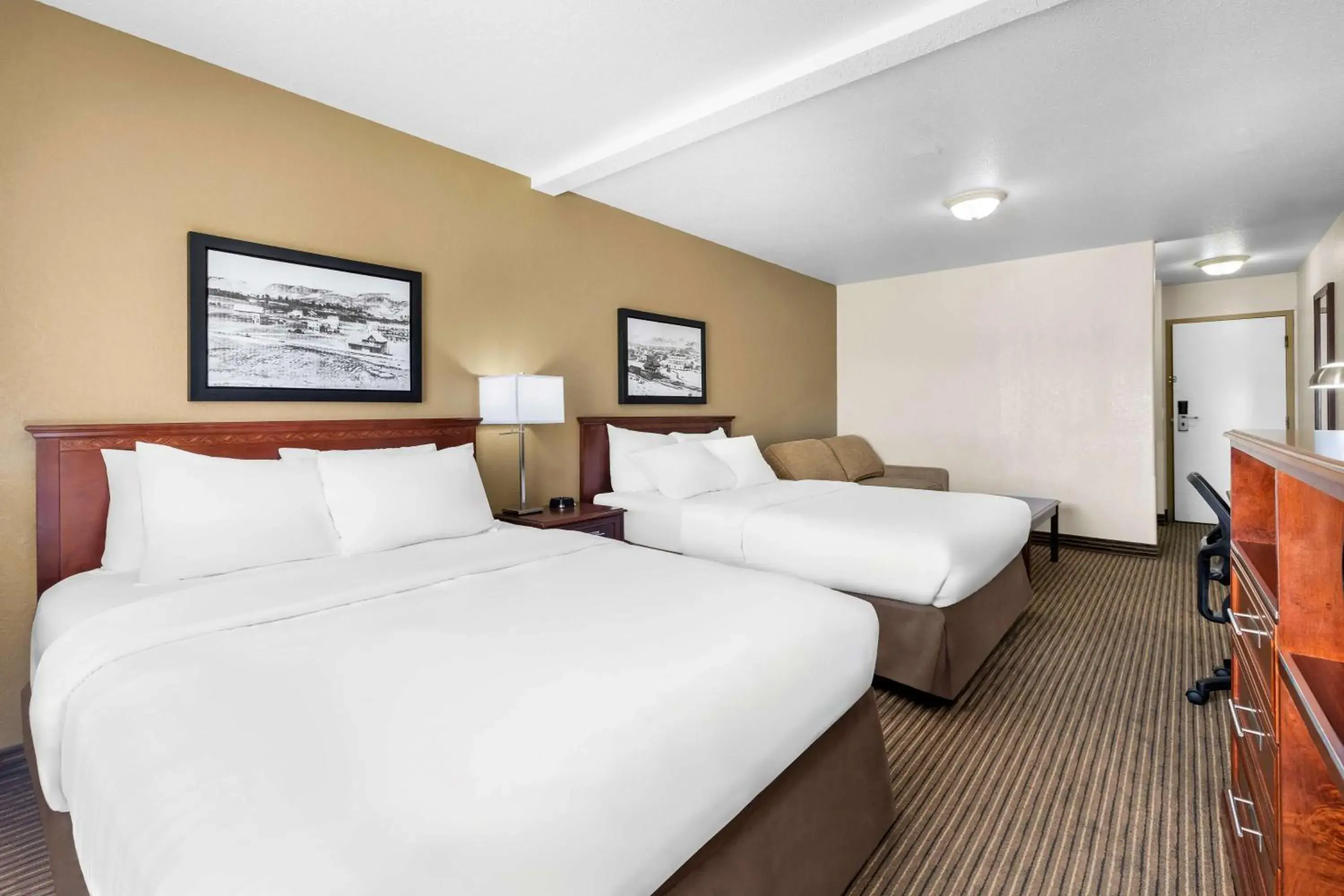 Queen Room with Two Queen Beds with Sofa Bed in SureStay Plus Hotel by Best Western Drumheller Queen Room with Two Queen Beds with Sofa Bed in SureStay Plus Hotel by Best Western Drumheller