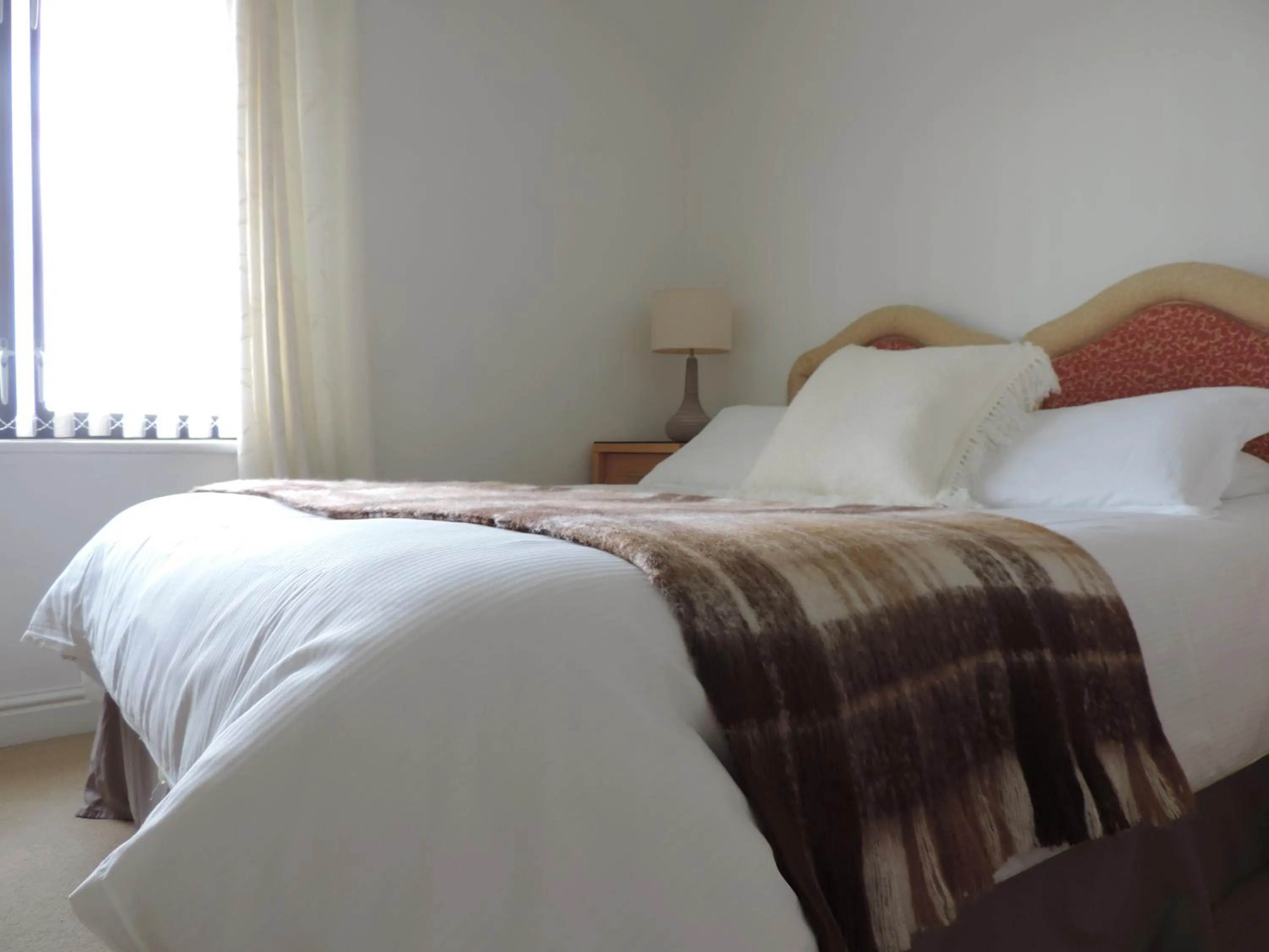 Bed in Sea Breeze Apartment