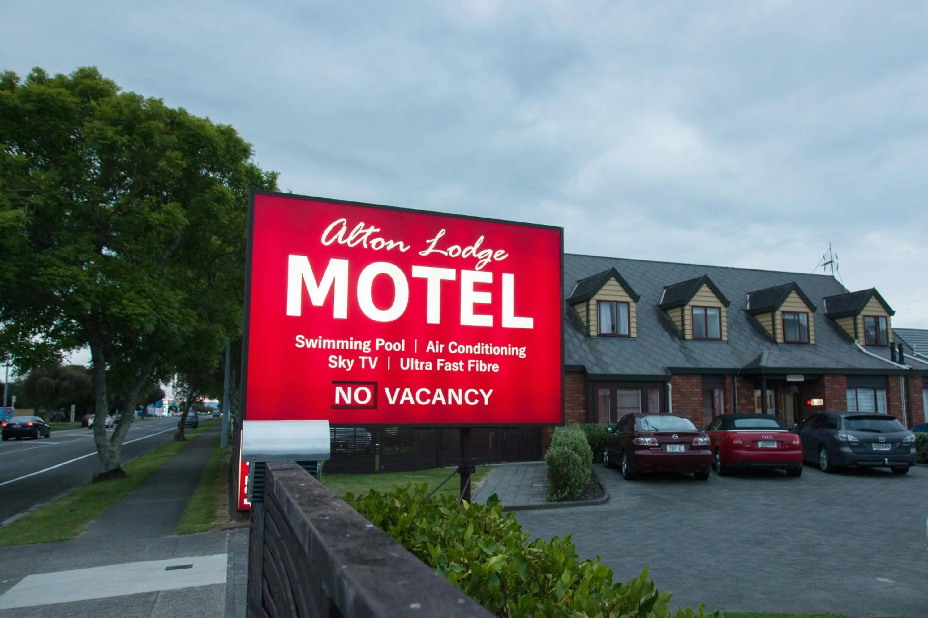 Property logo or sign in Alton Lodge Motel