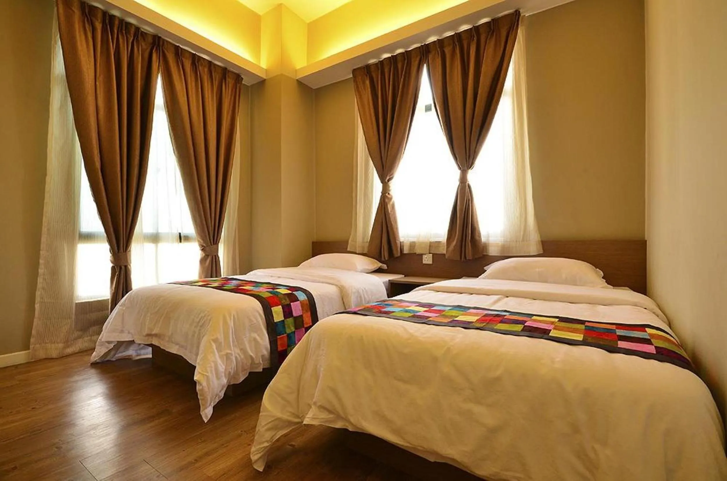 Bed in Jetty Suites Apartments