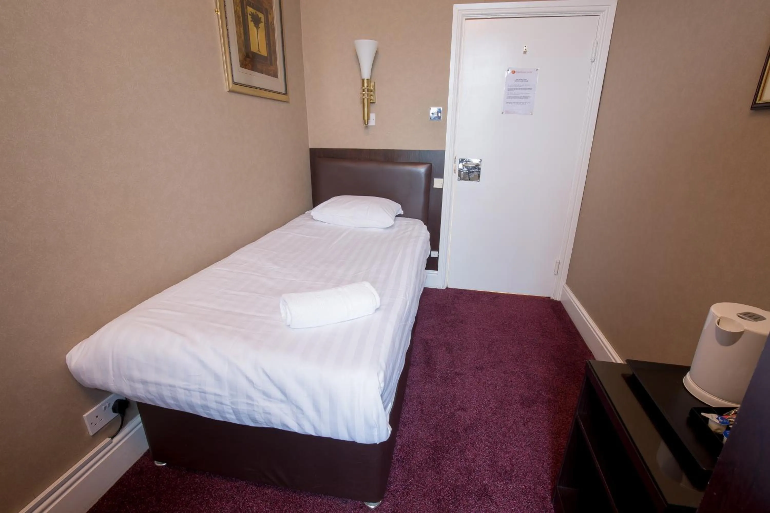 Bed in Rossmore Hotel