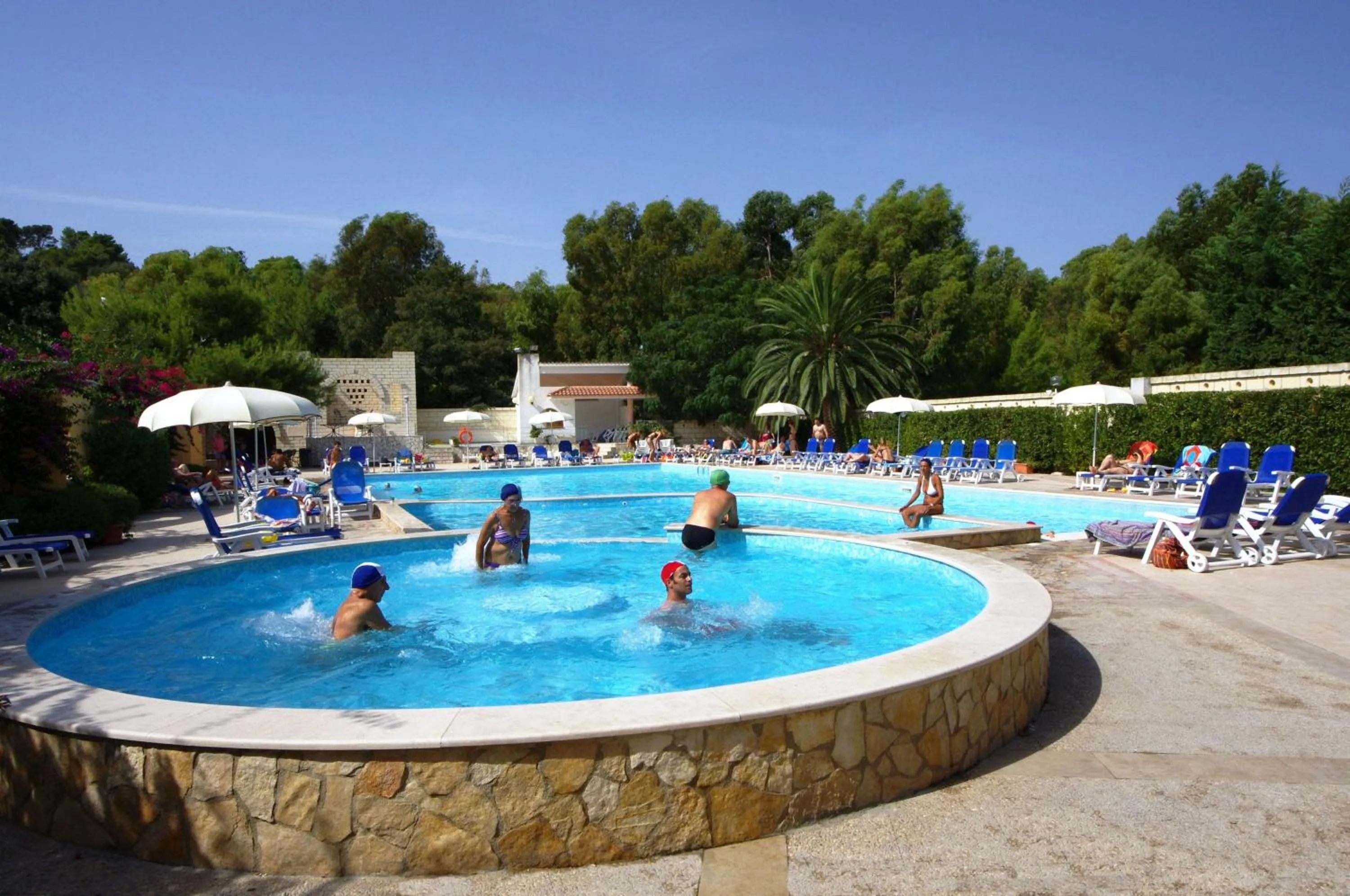 Swimming pool in Baia Degli Aranci Suite & Apartments