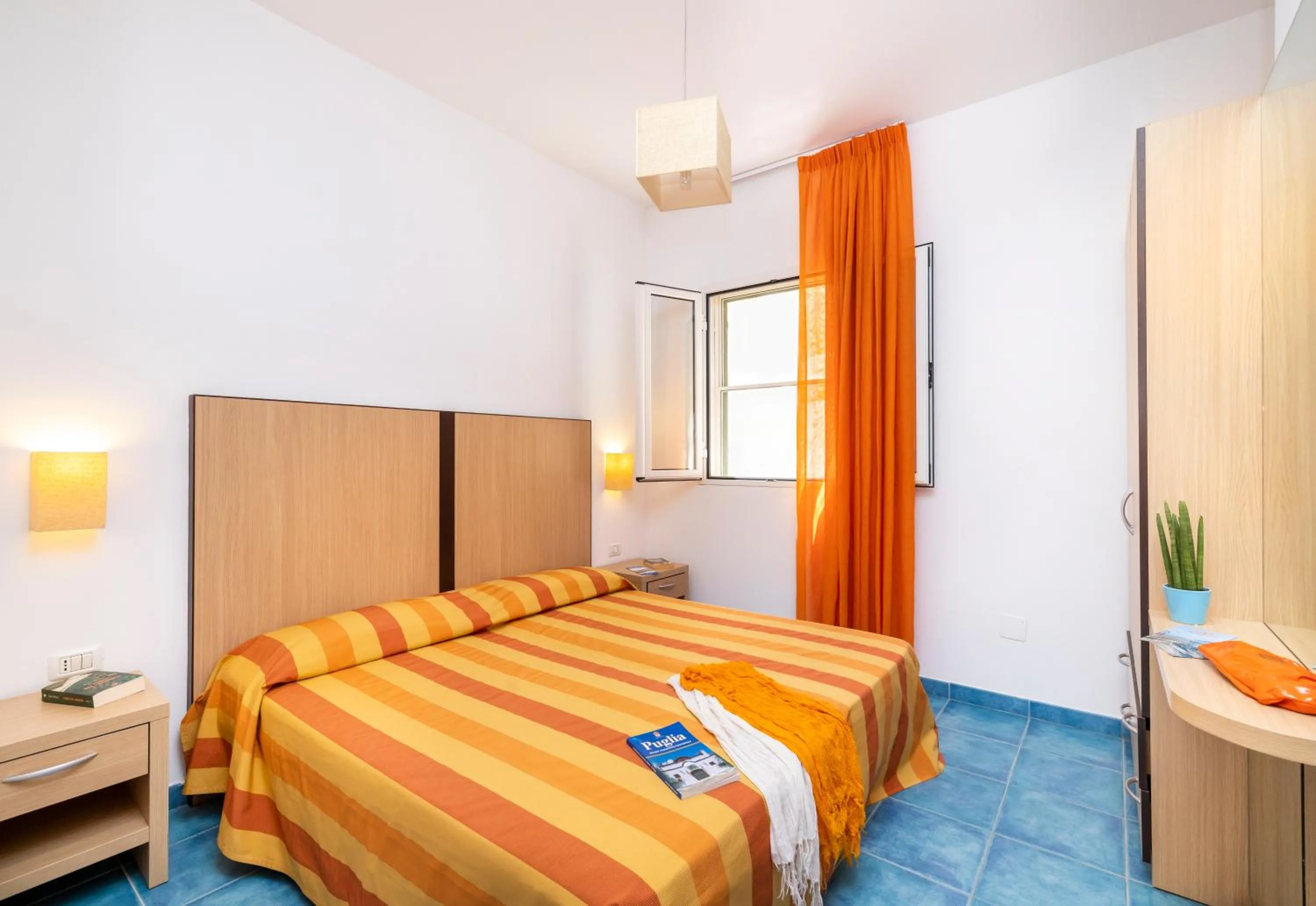 Bed in Baia Degli Aranci Suite & Apartments
