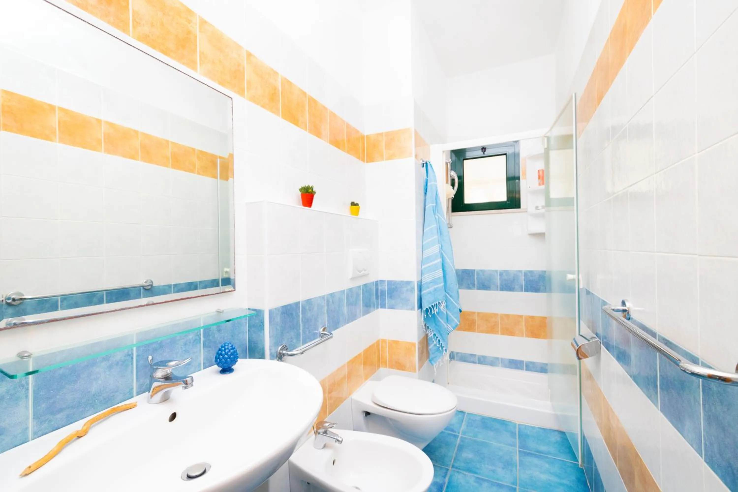 Bathroom in Baia Degli Aranci Suite & Apartments
