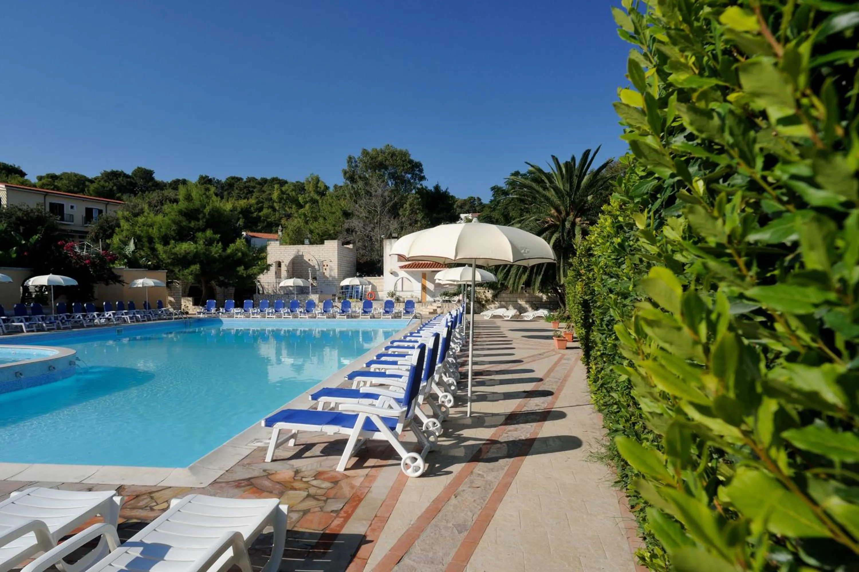 Swimming pool in Baia Degli Aranci Suite & Apartments