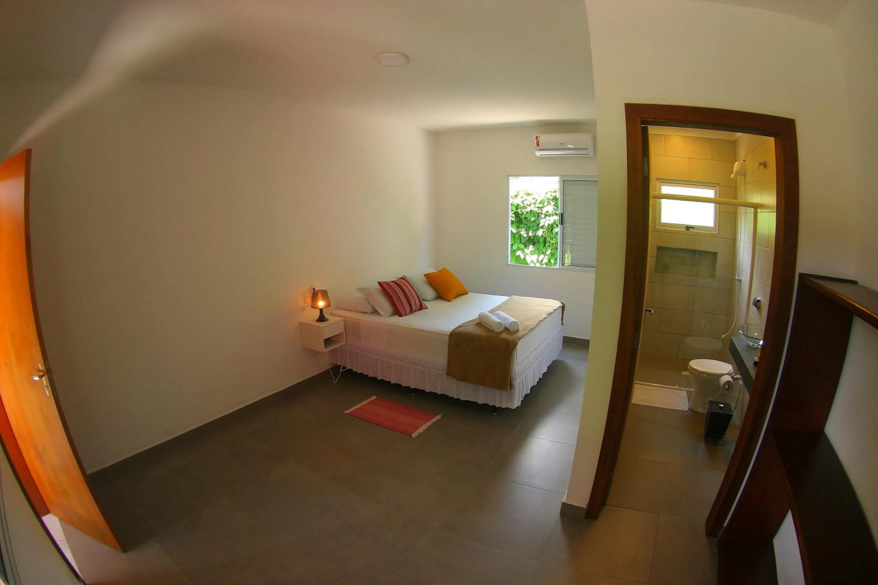 Bed in Pousada Tubes Maresias