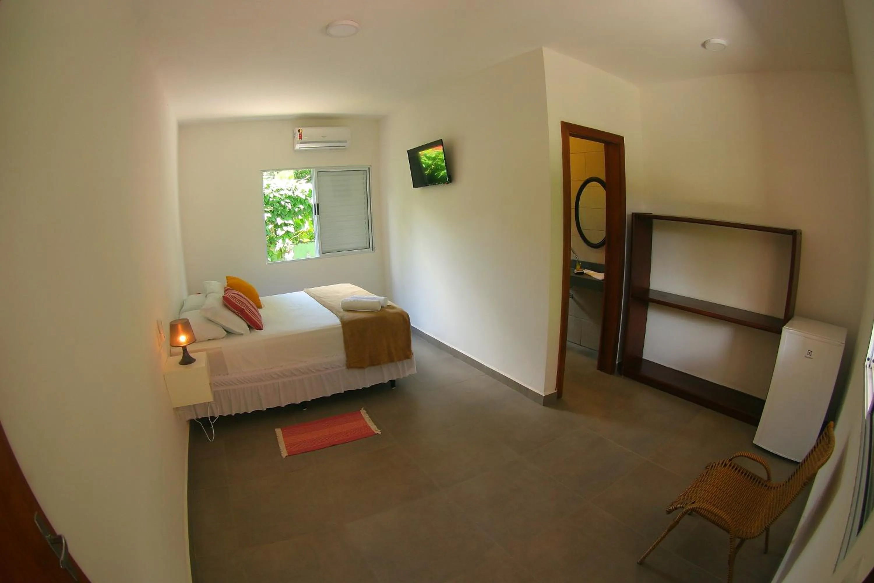 Bed in Pousada Tubes Maresias