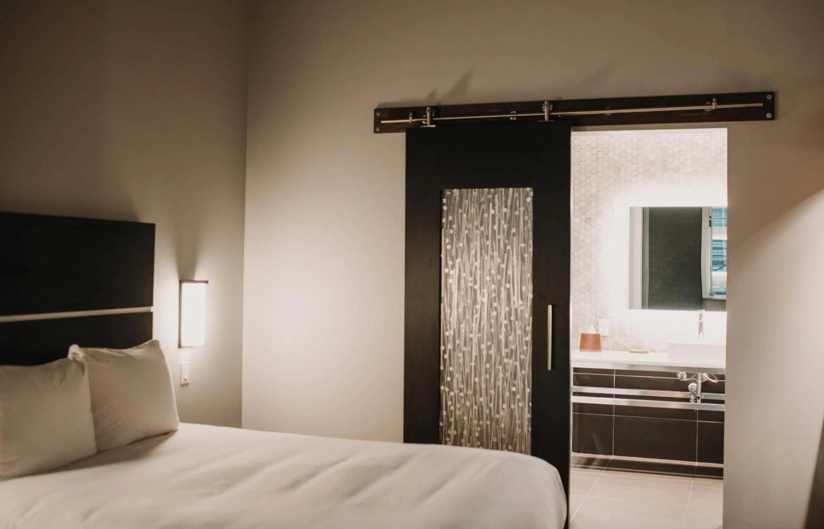 Bedroom, Bed in CityFlatsHotel - Grand Rapids, an Ascend Collection Hotel