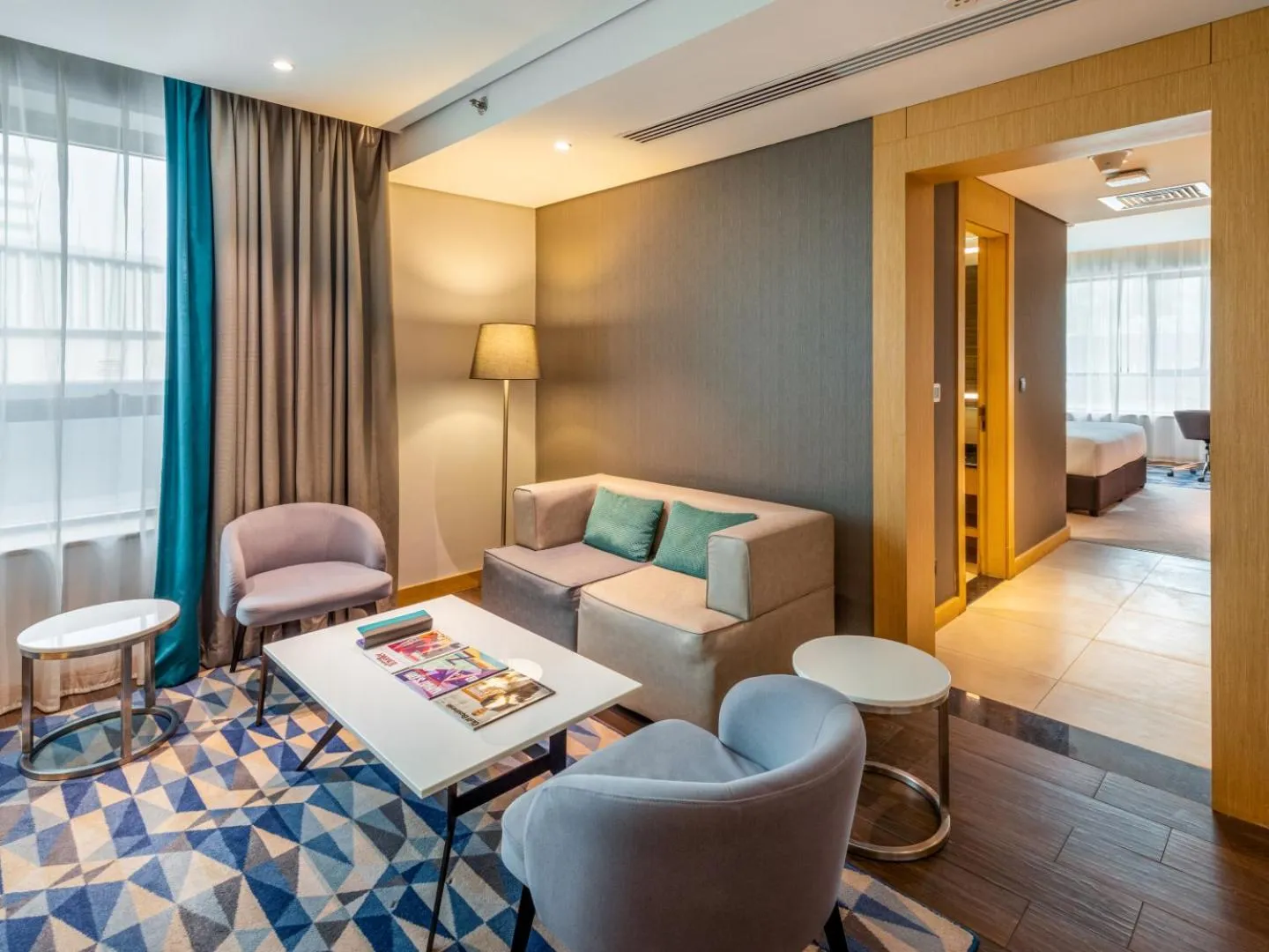 Living room, Bed in Flora Inn Hotel Dubai Airport