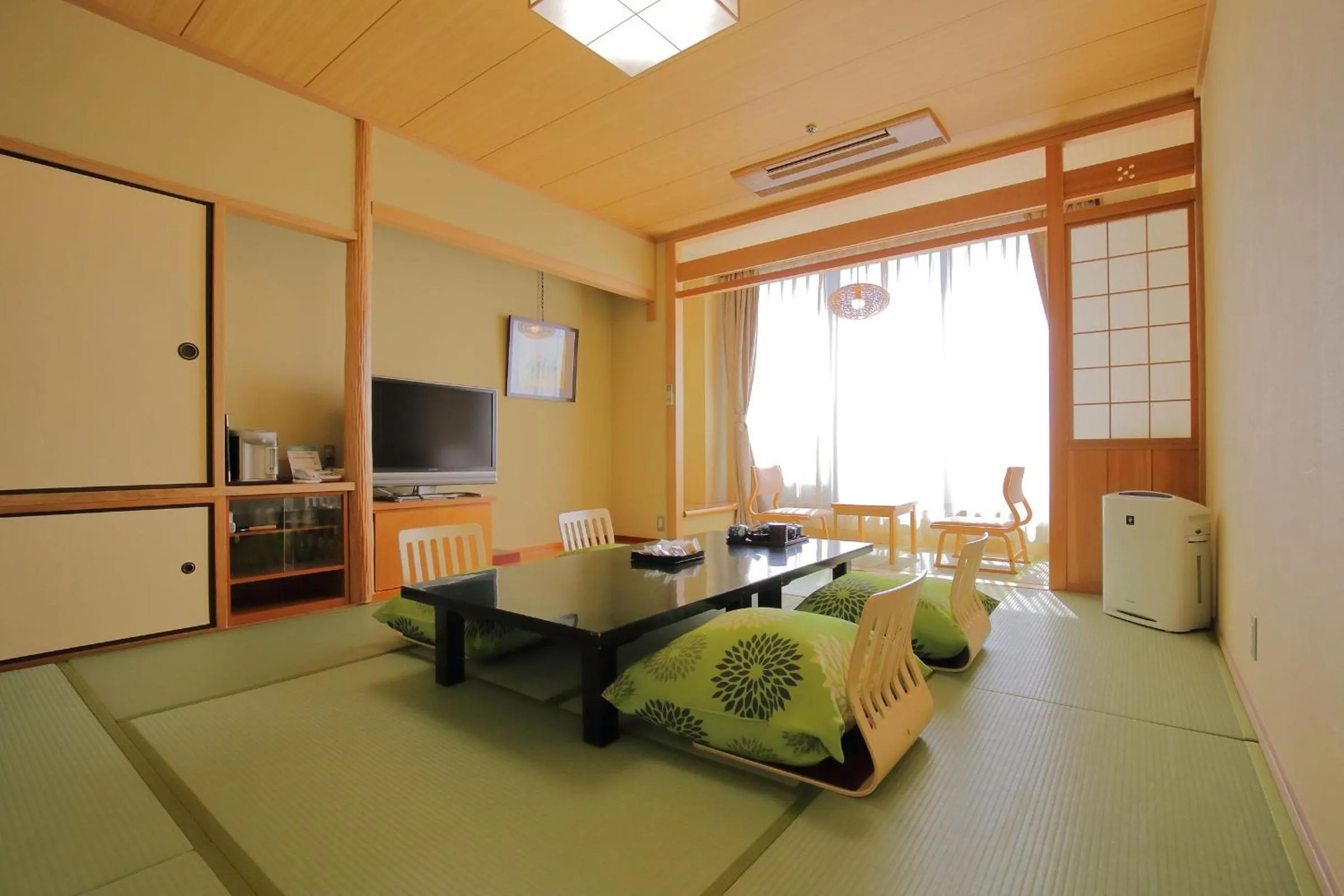 Living room, Bed in Dogo Prince Hotel