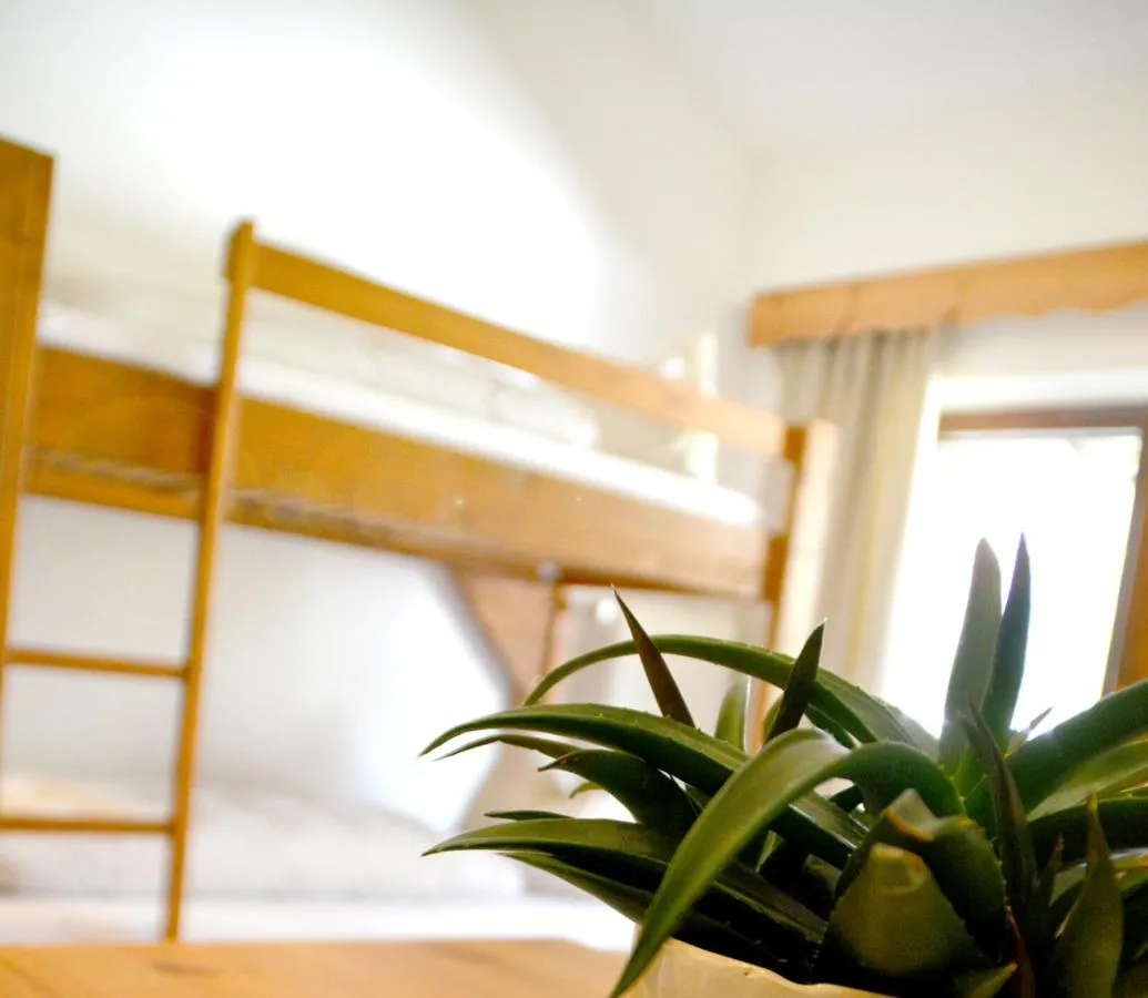 Bed in Pension Almhof Baumgarten