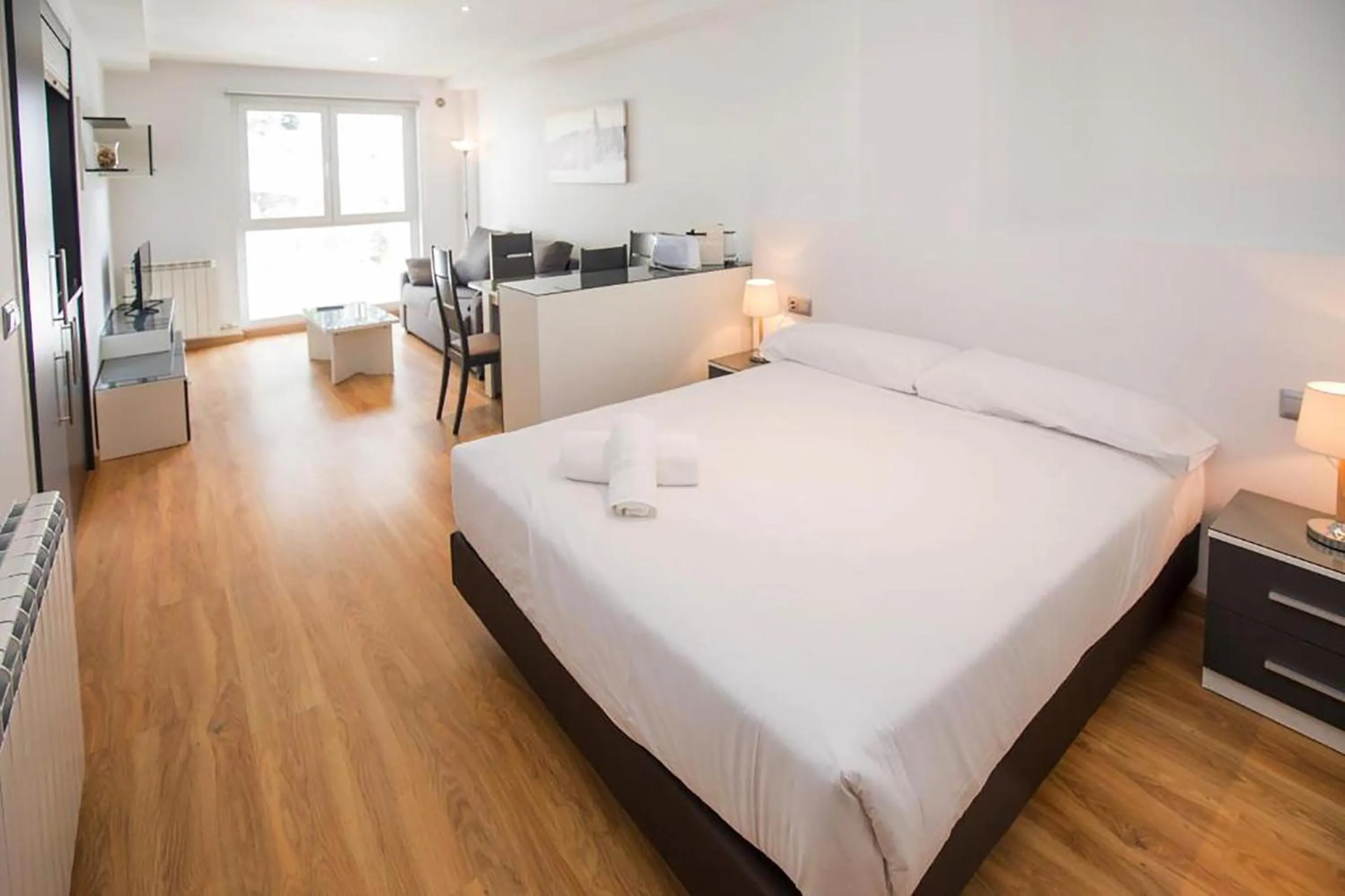 Living room, Bed in The Lodge at Ribasol