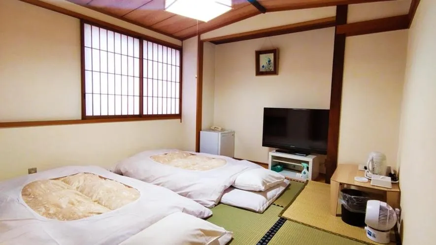 Bed in Hotel Sakuranbo