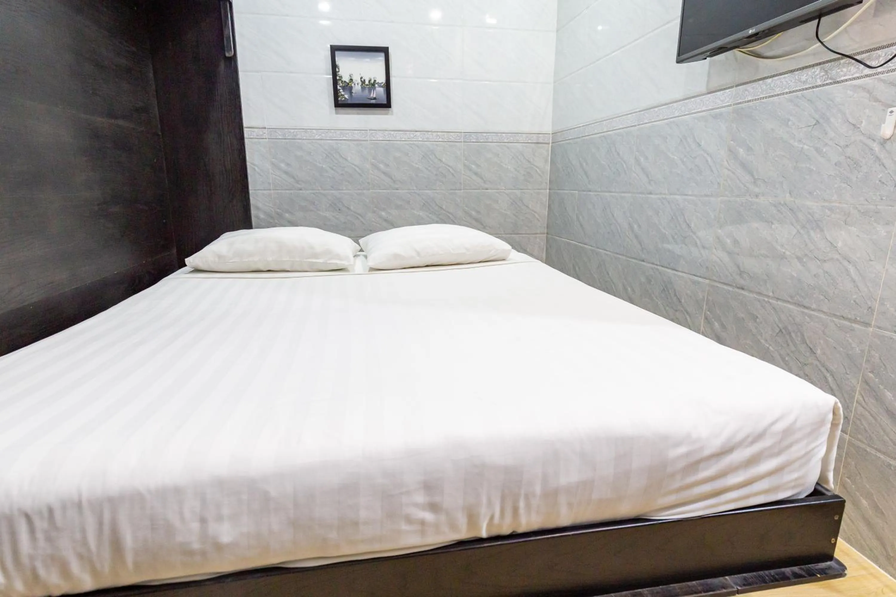 Bed in Cola's Homestay