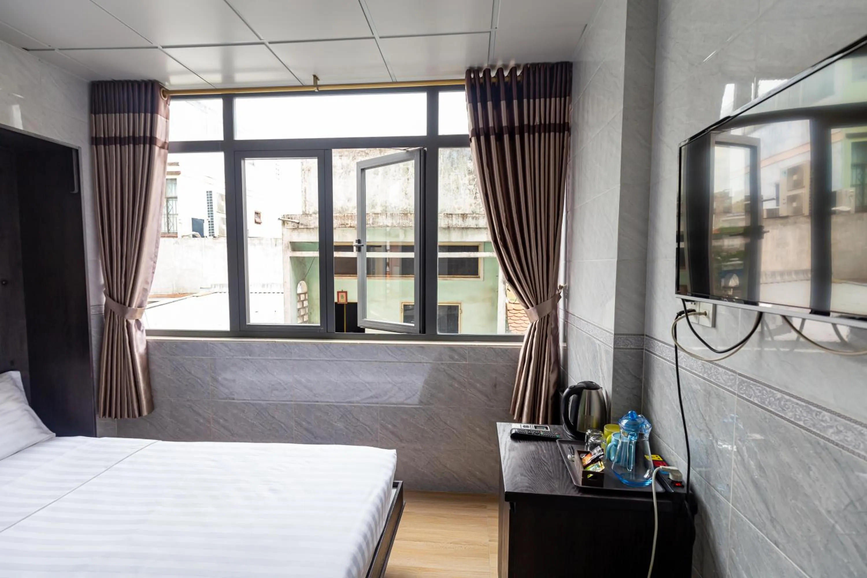 Photo of the whole room, Bed in Cola's Homestay