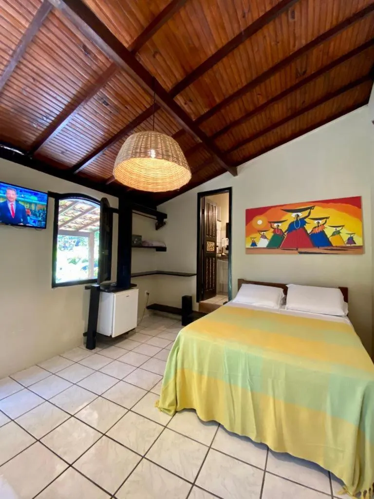 Bed in Pousada Tubarão