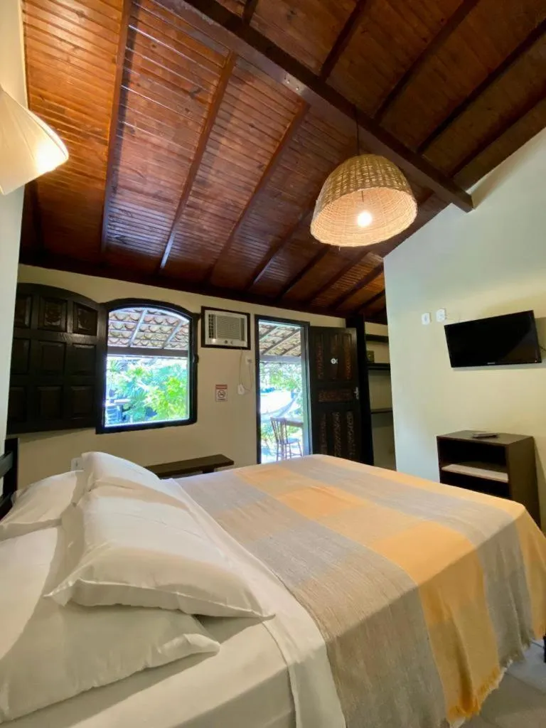 Bed in Pousada Tubarão
