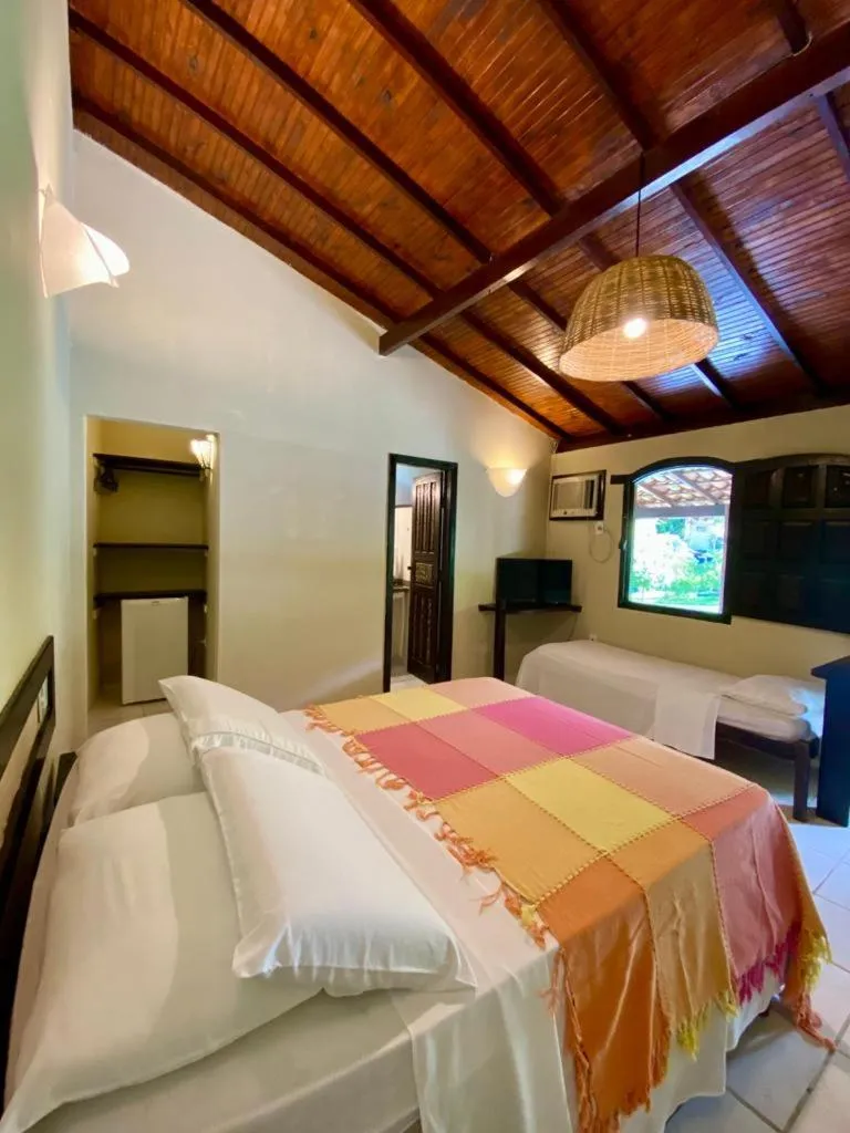 Bed in Pousada Tubarão