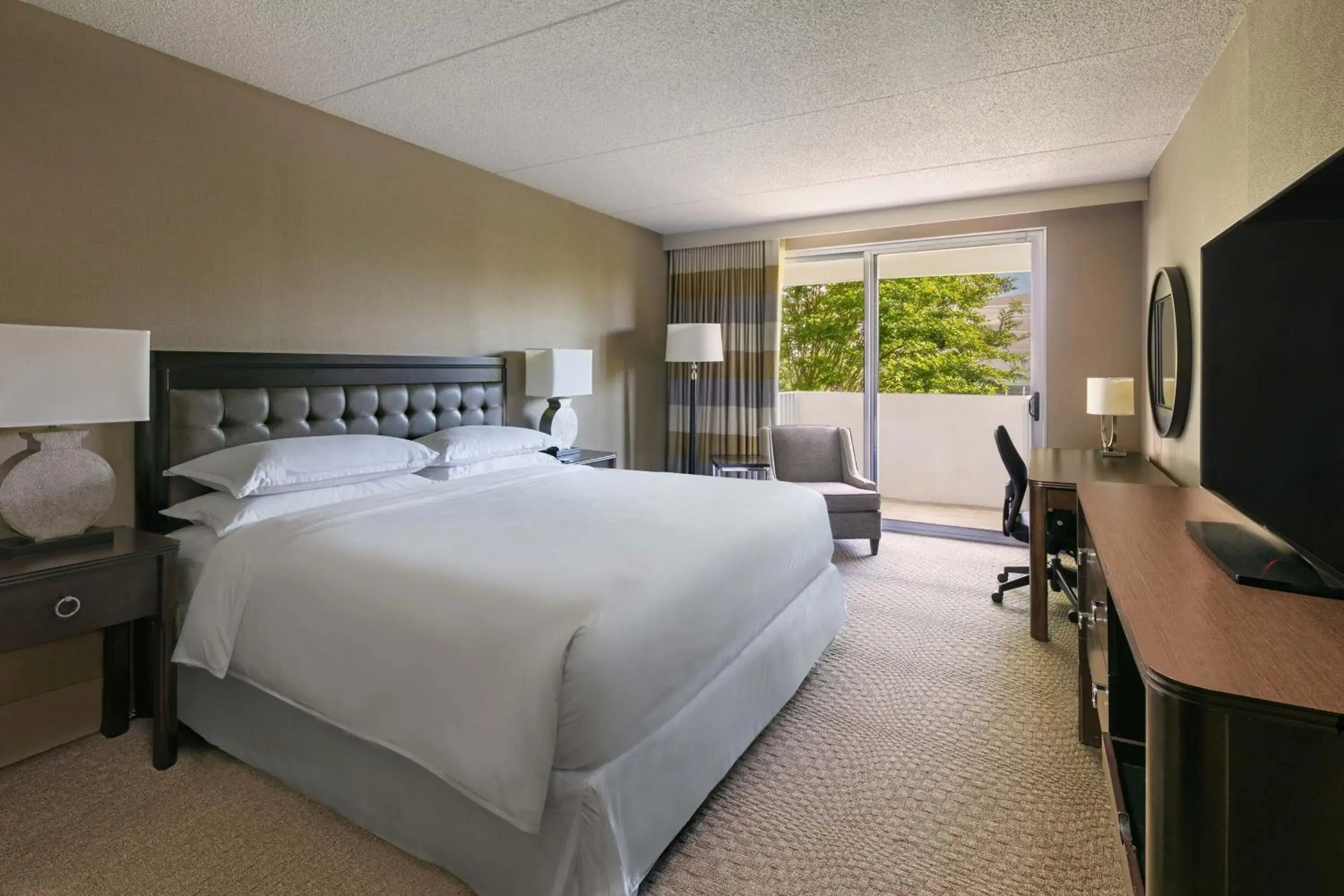 Guest room, 1 King, Low Rise Bldg, Balcony in Sheraton Greensboro Guest room, 1 King, Low Rise Bldg, Balcony in Sheraton Greensboro