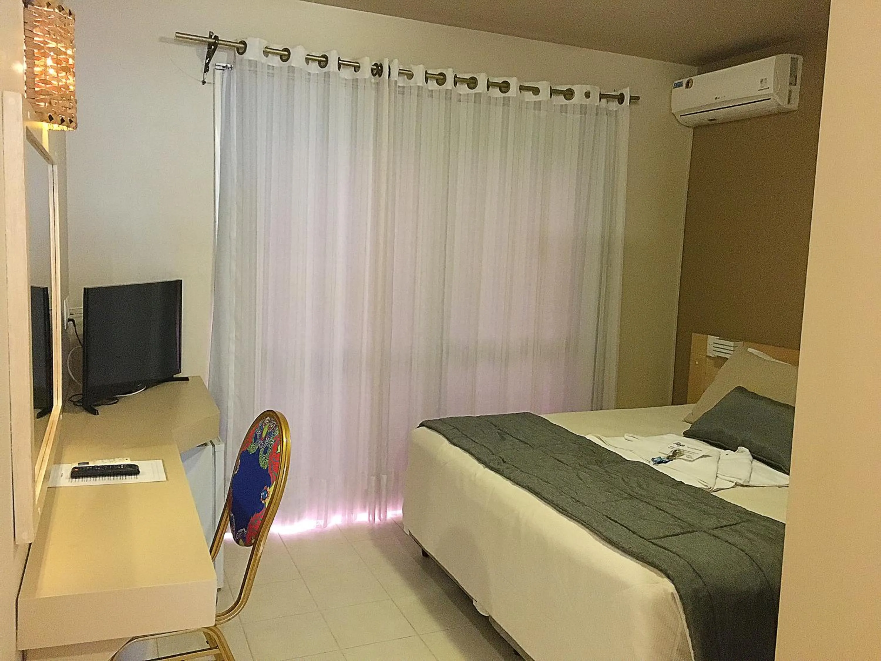 Bed in Pousada Tango