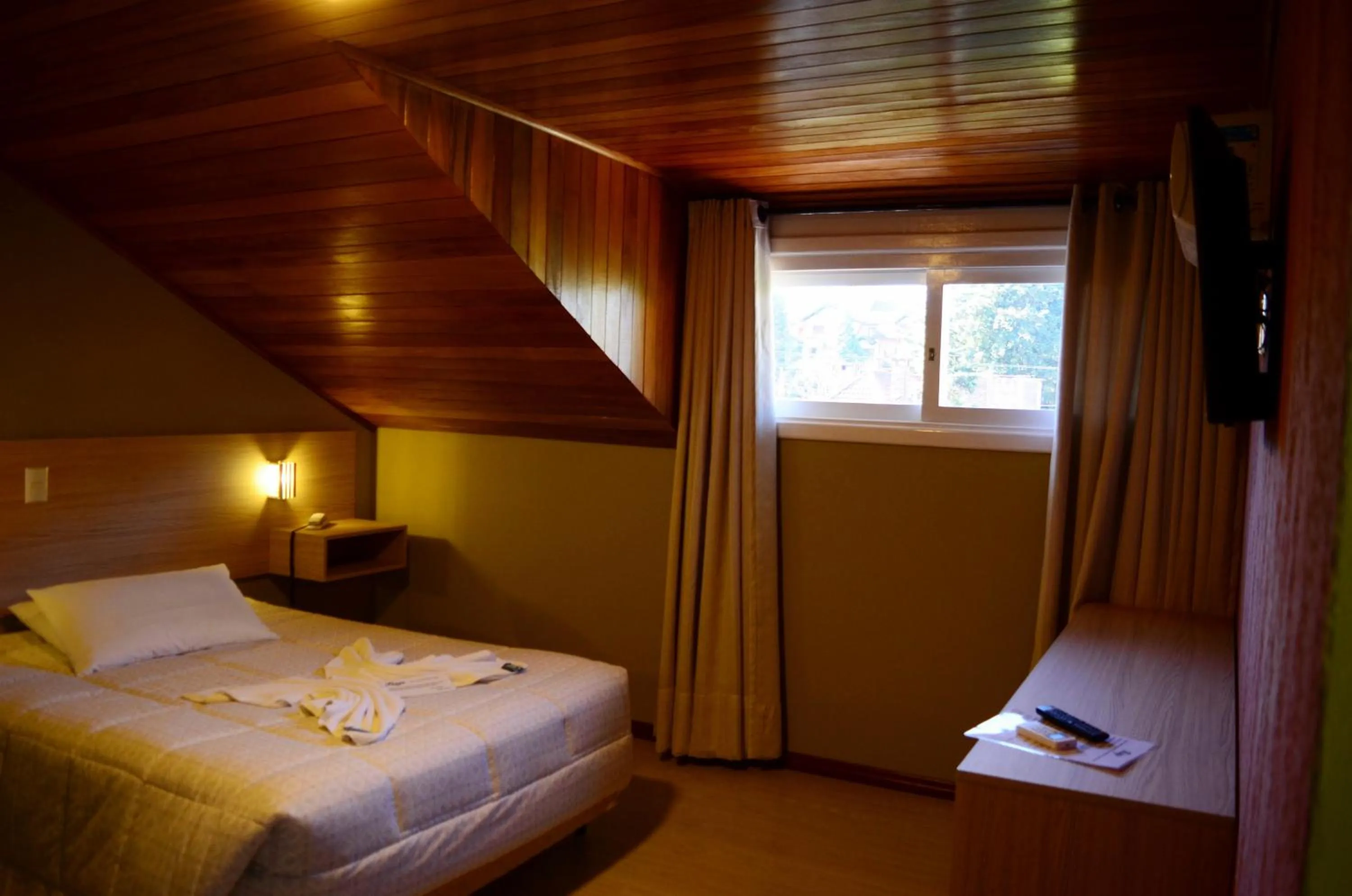 Bed in Pousada Tango