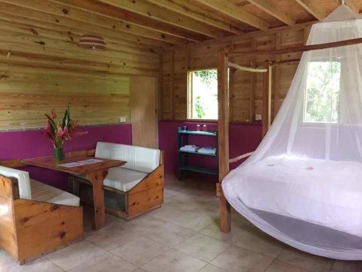 Living room, Bed in Roots Jungle Retreat