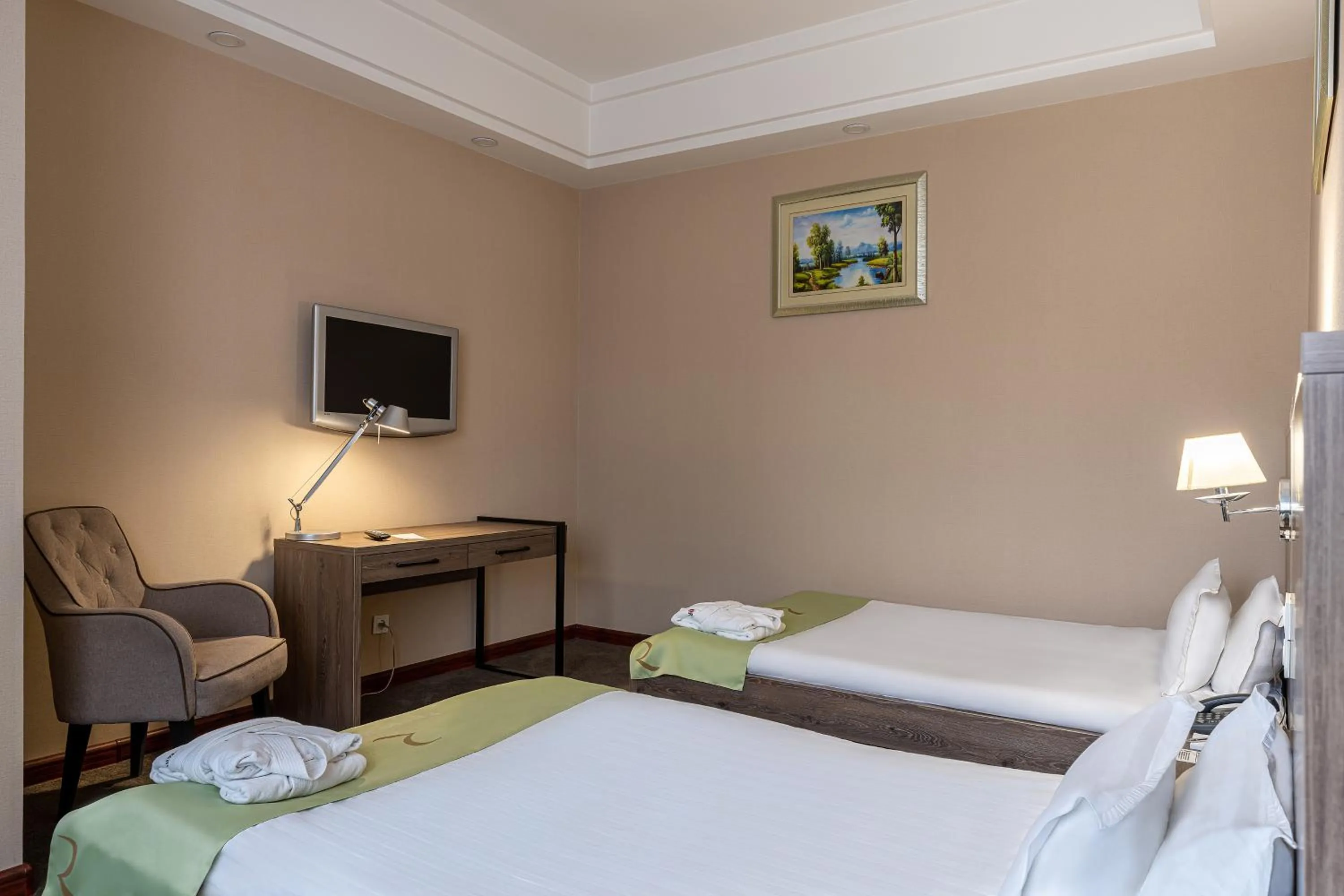 Bed in Renion Residence Hotel