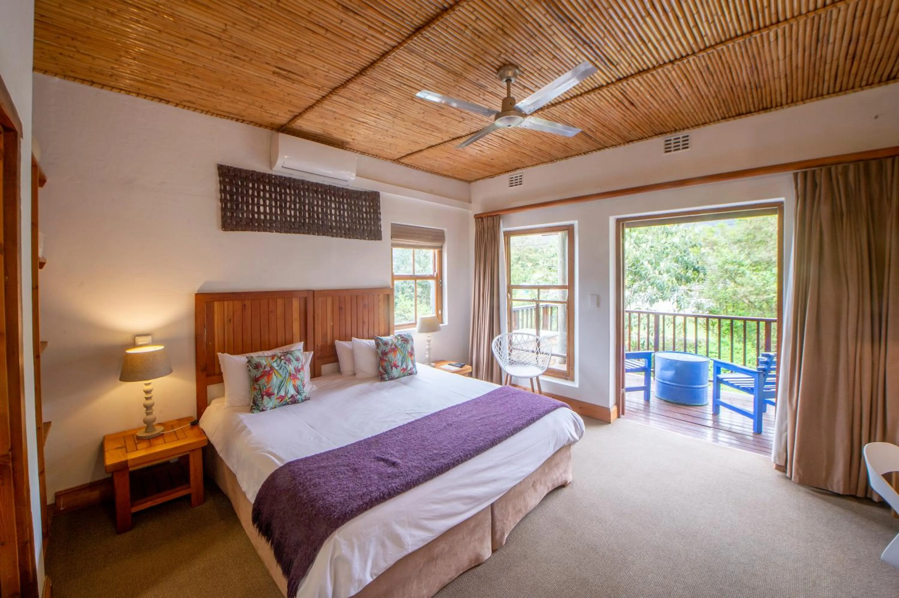 Bed in At the Woods Guest House