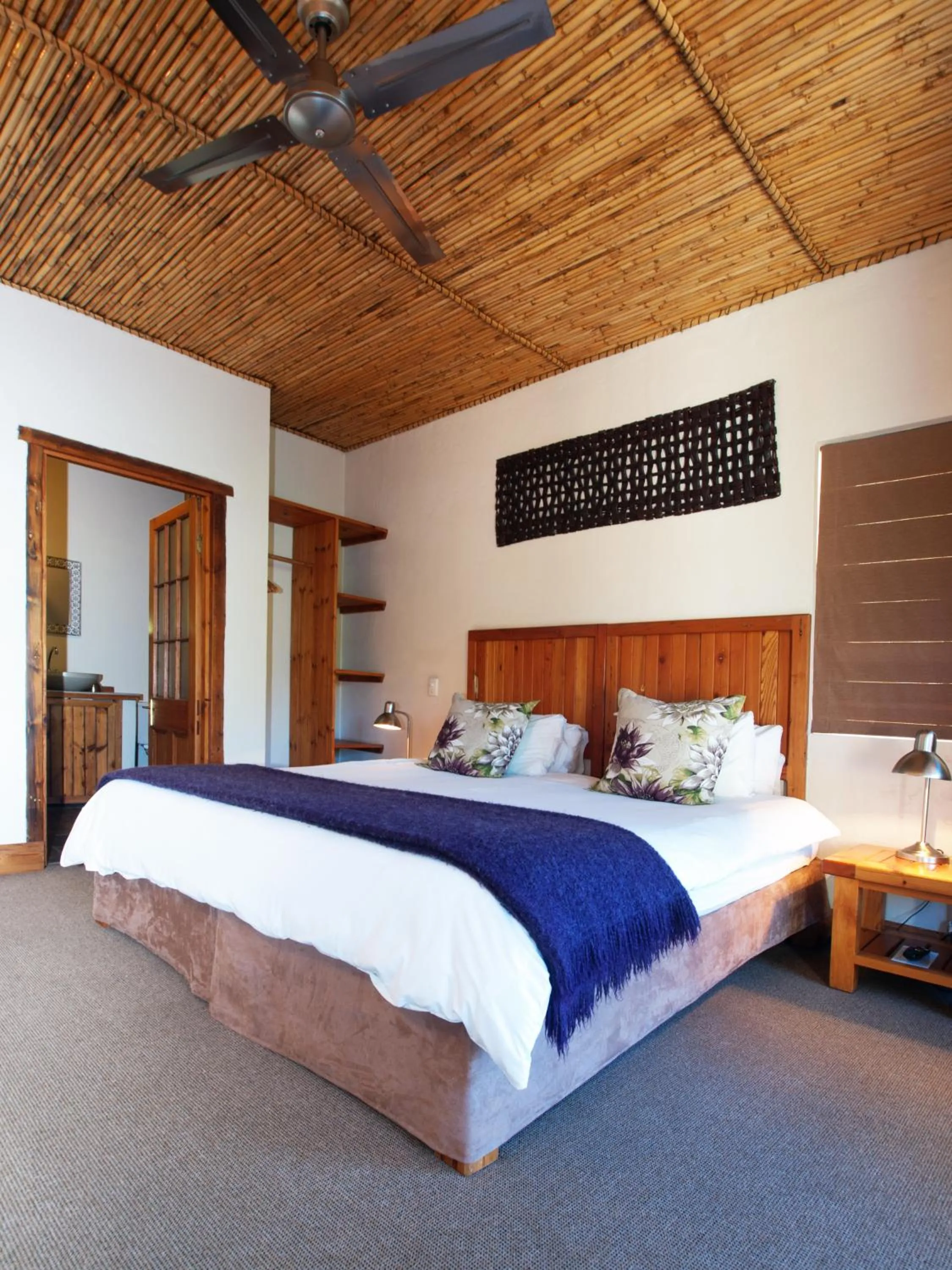 Bed in At the Woods Guest House