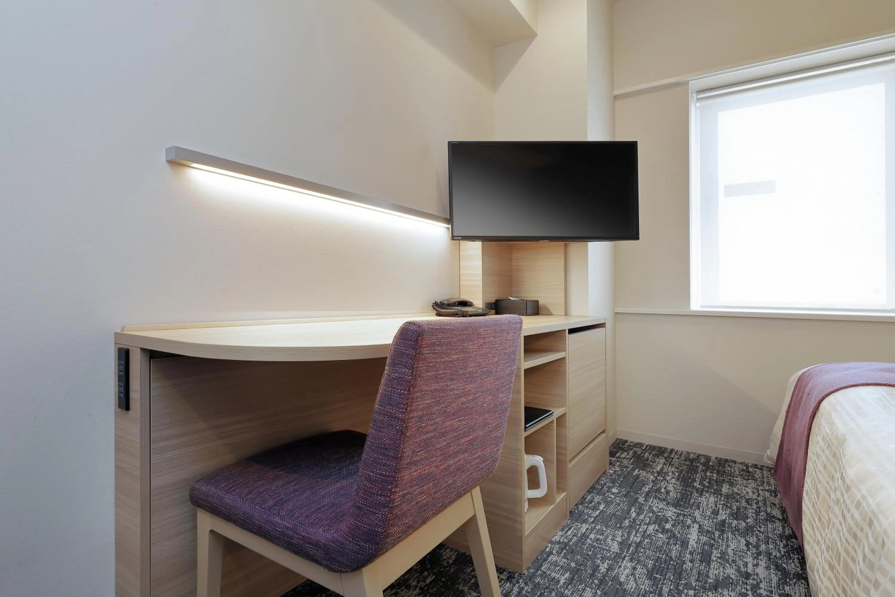 Bed in Keio Presso Inn Tokyo Kudanshita