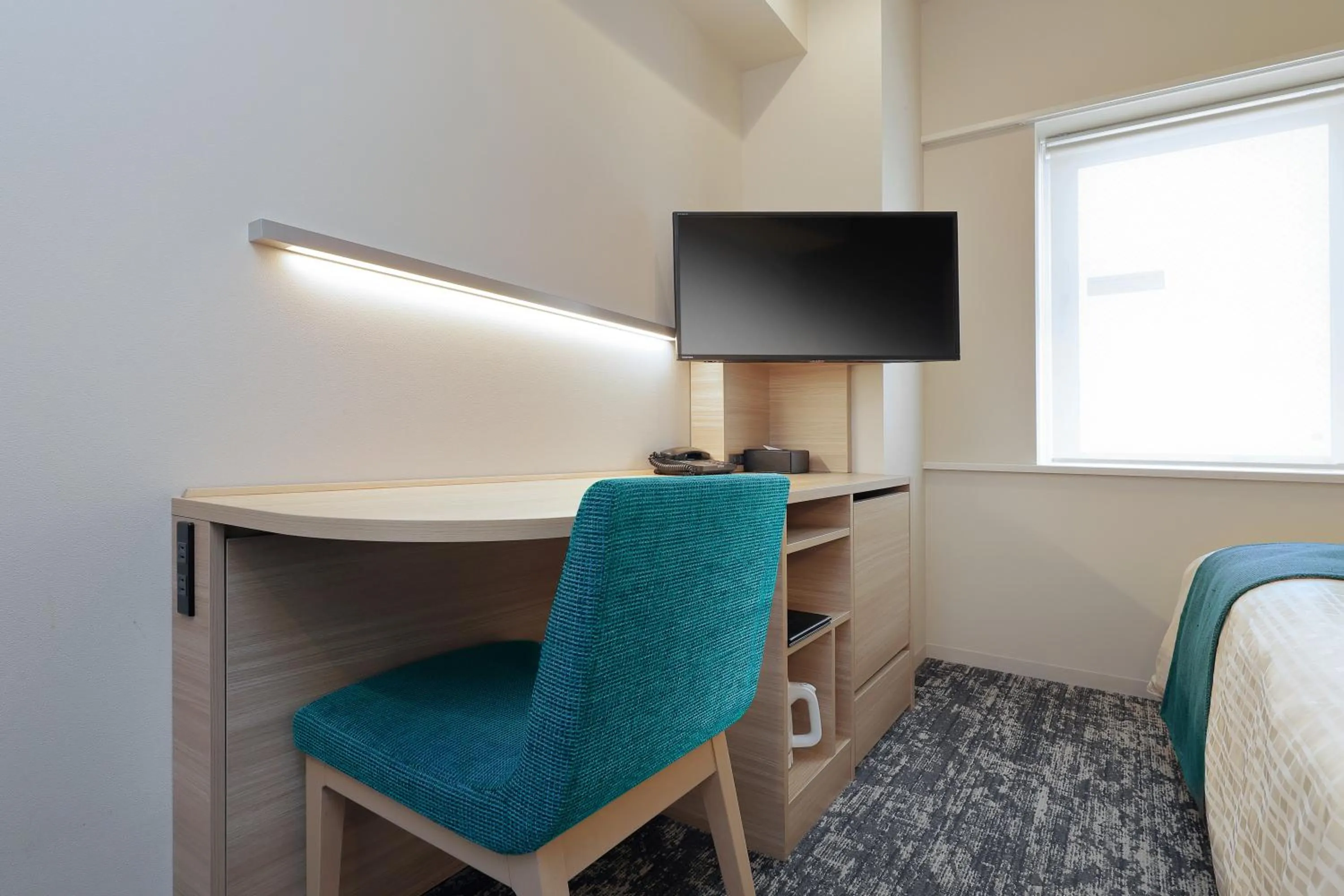 Bed in Keio Presso Inn Tokyo Kudanshita