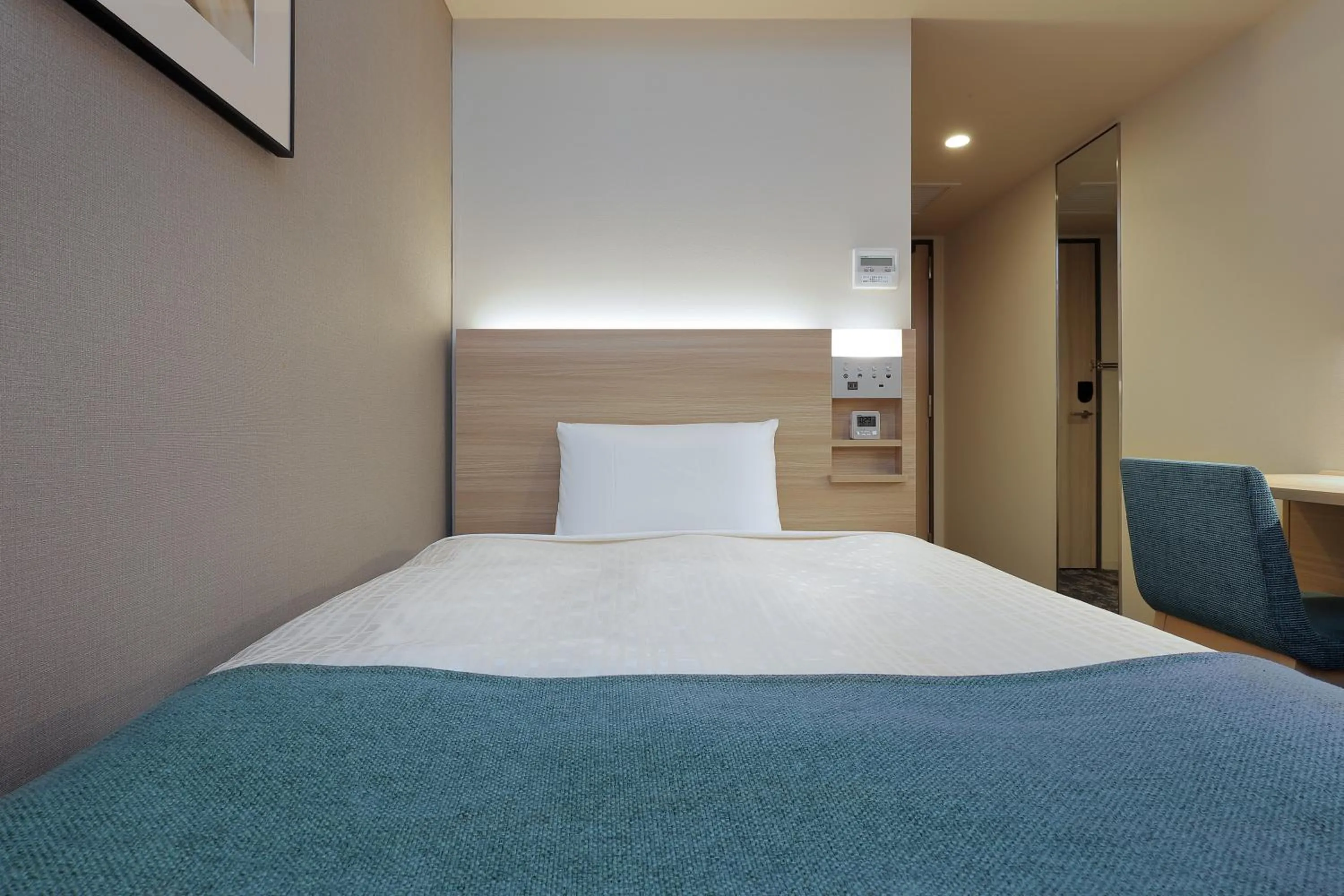 Bed in Keio Presso Inn Tokyo Kudanshita