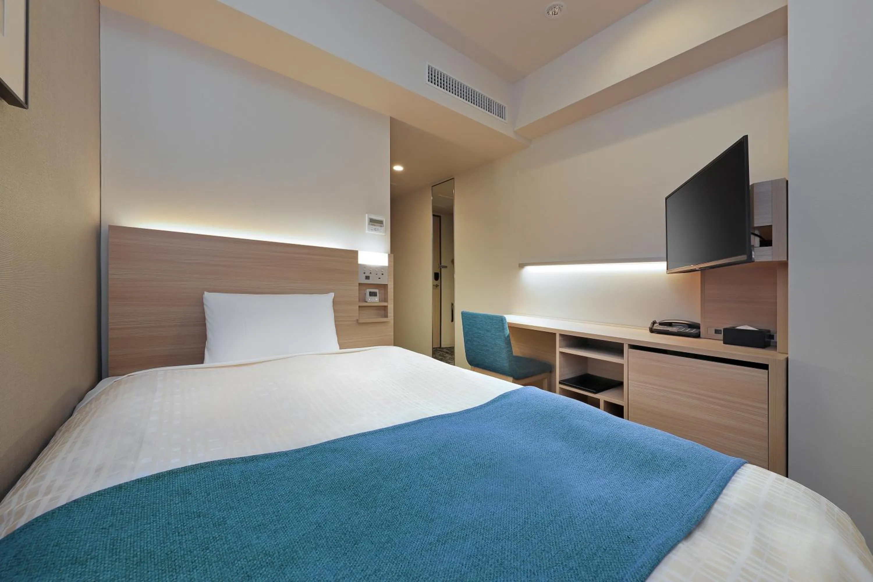 Bed in Keio Presso Inn Tokyo Kudanshita