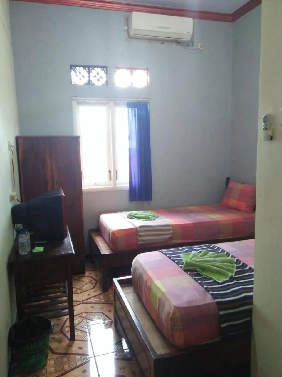 Bed in Penginapan Hotel Mangir Asri