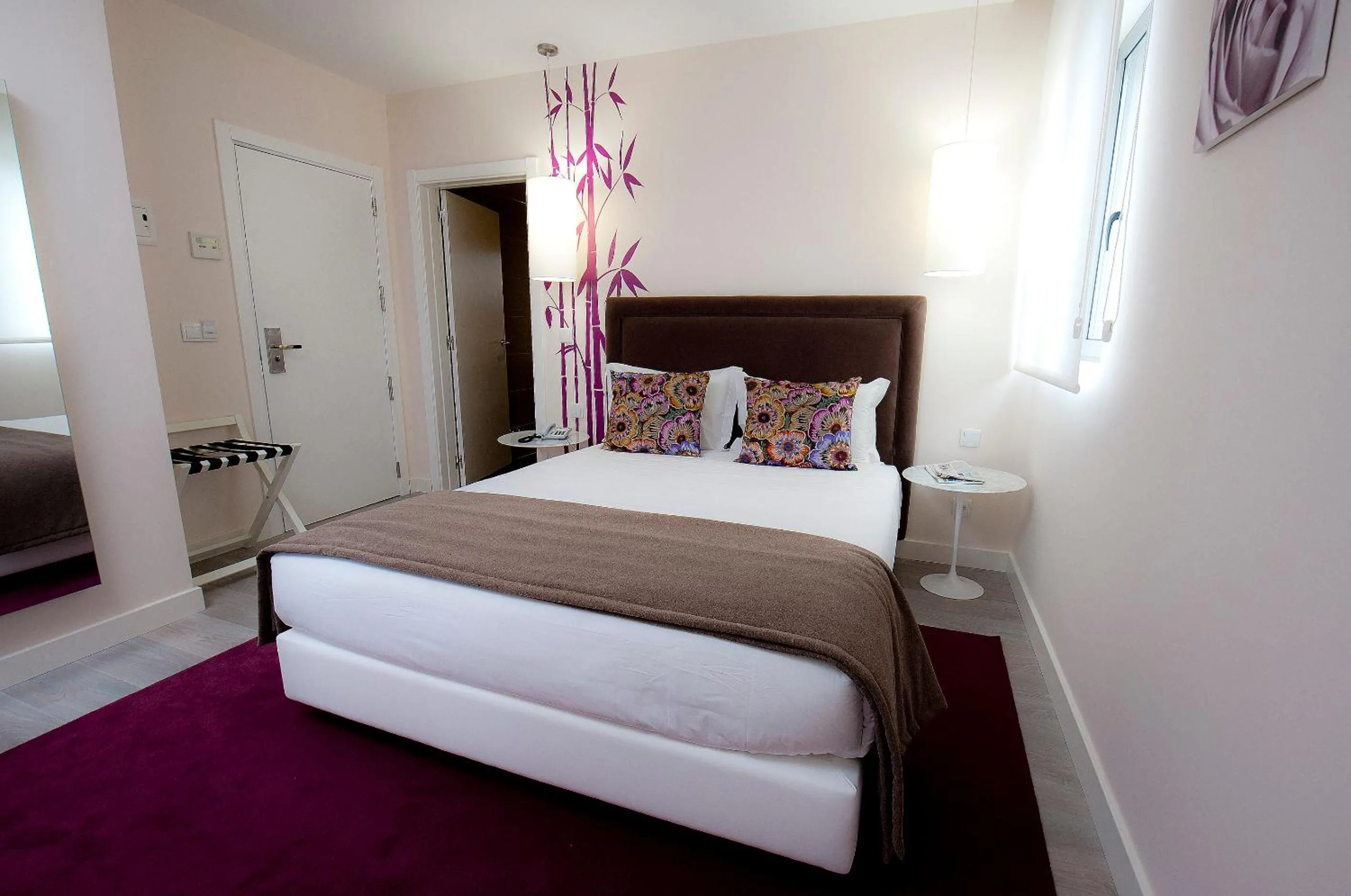 Bed in Primavera Perfume Hotel