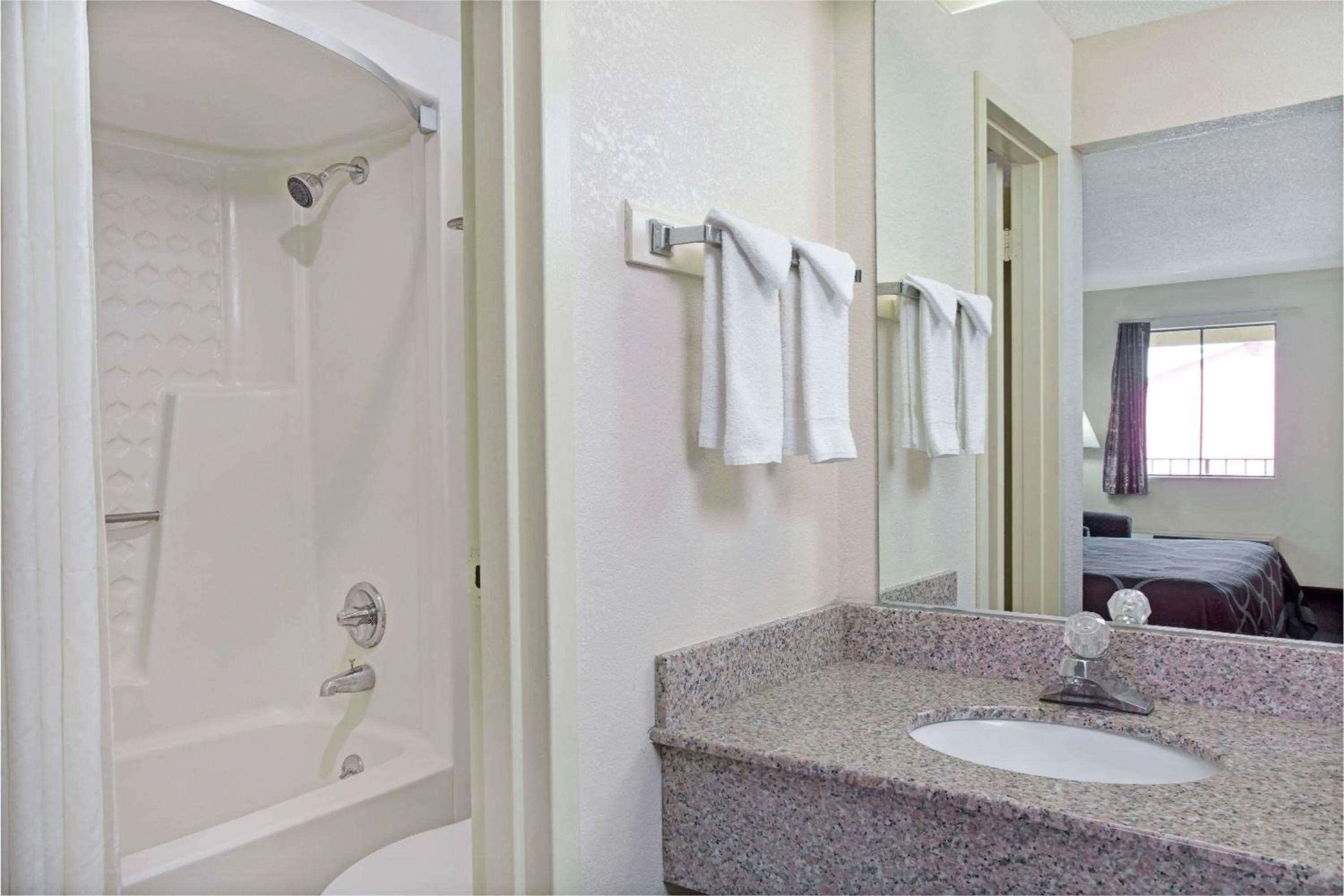 Bathroom in Super 8 by Wyndham Suwanee