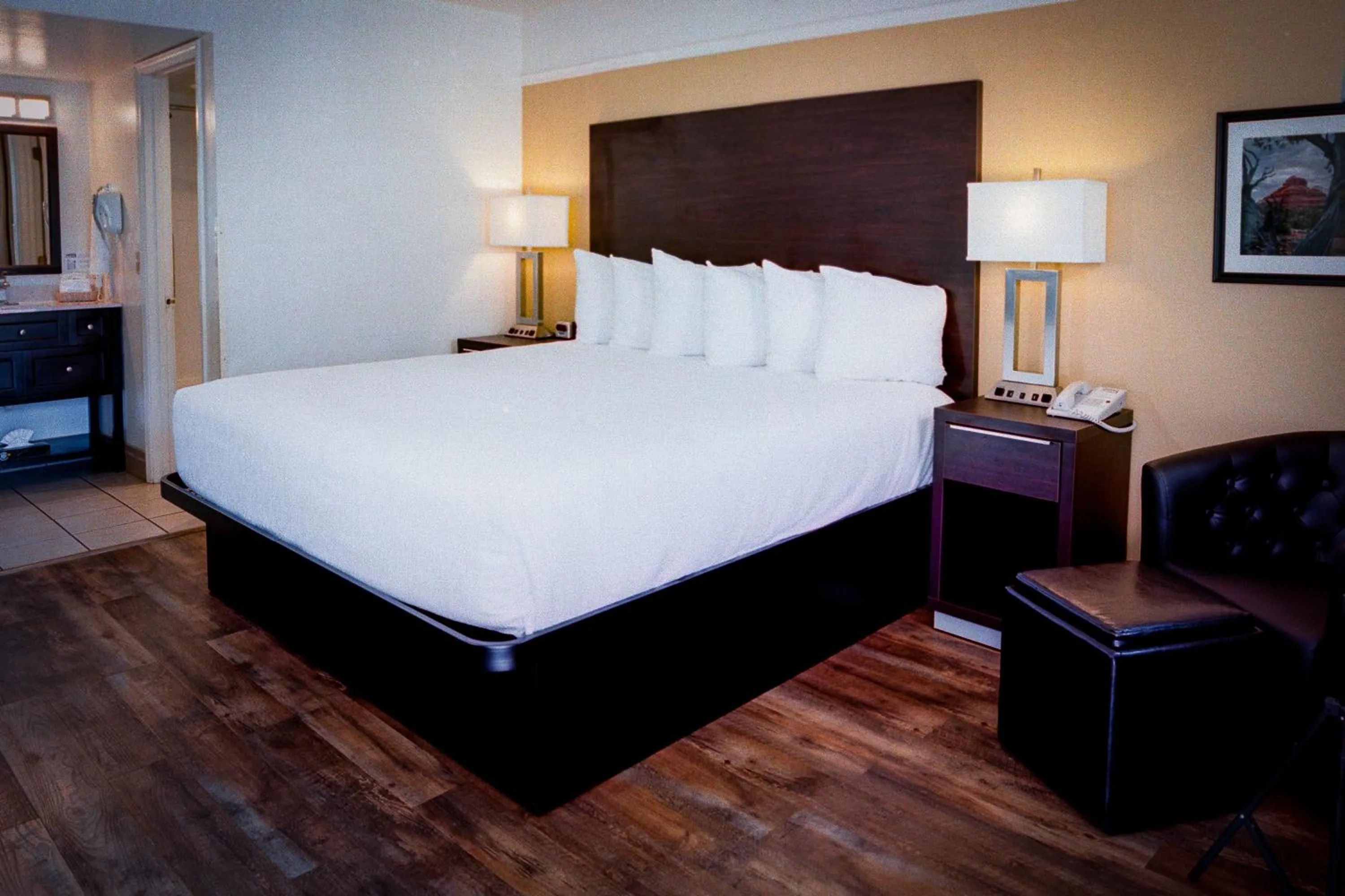 Bed in Pines Inn & Suites