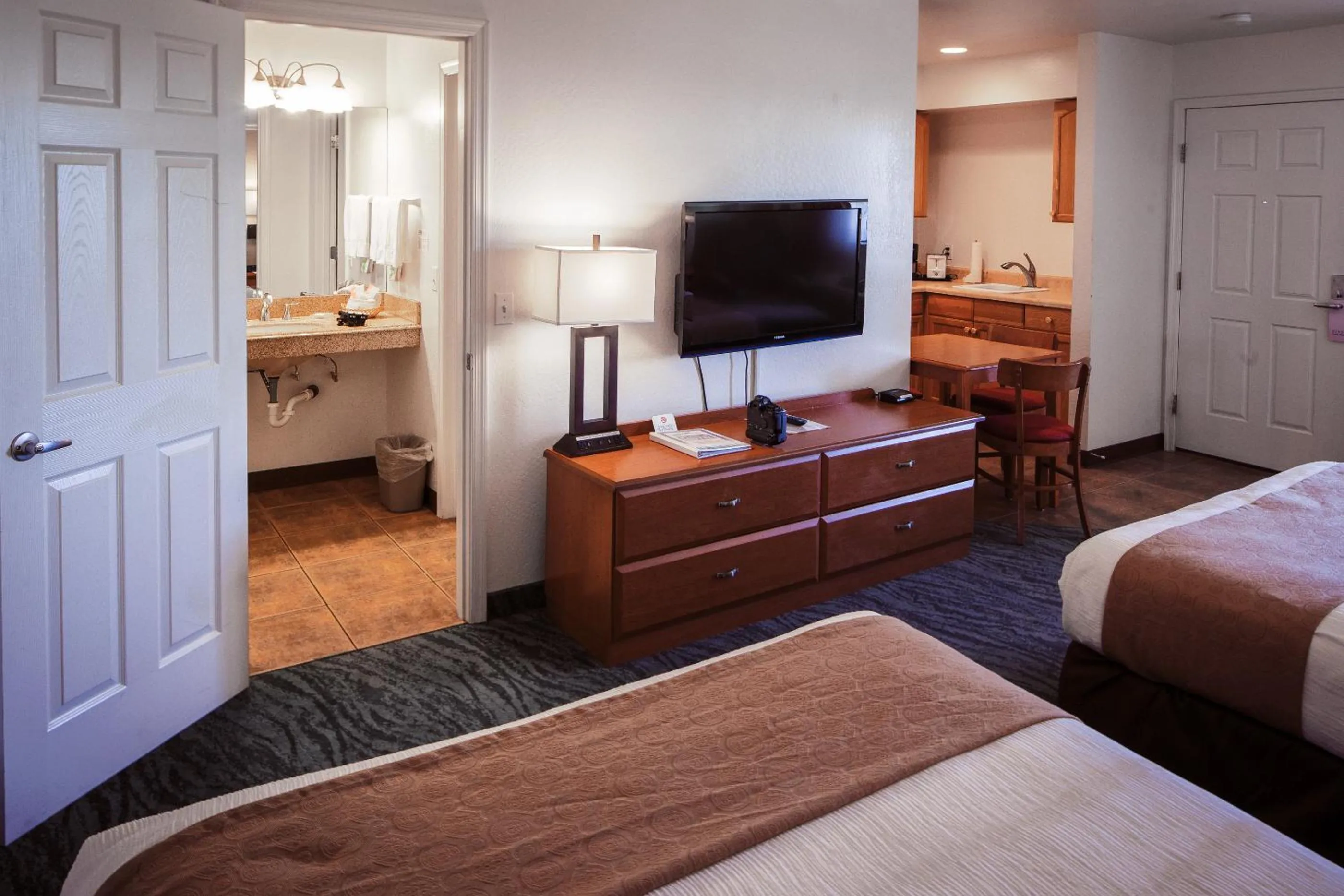 Bed in Pines Inn & Suites