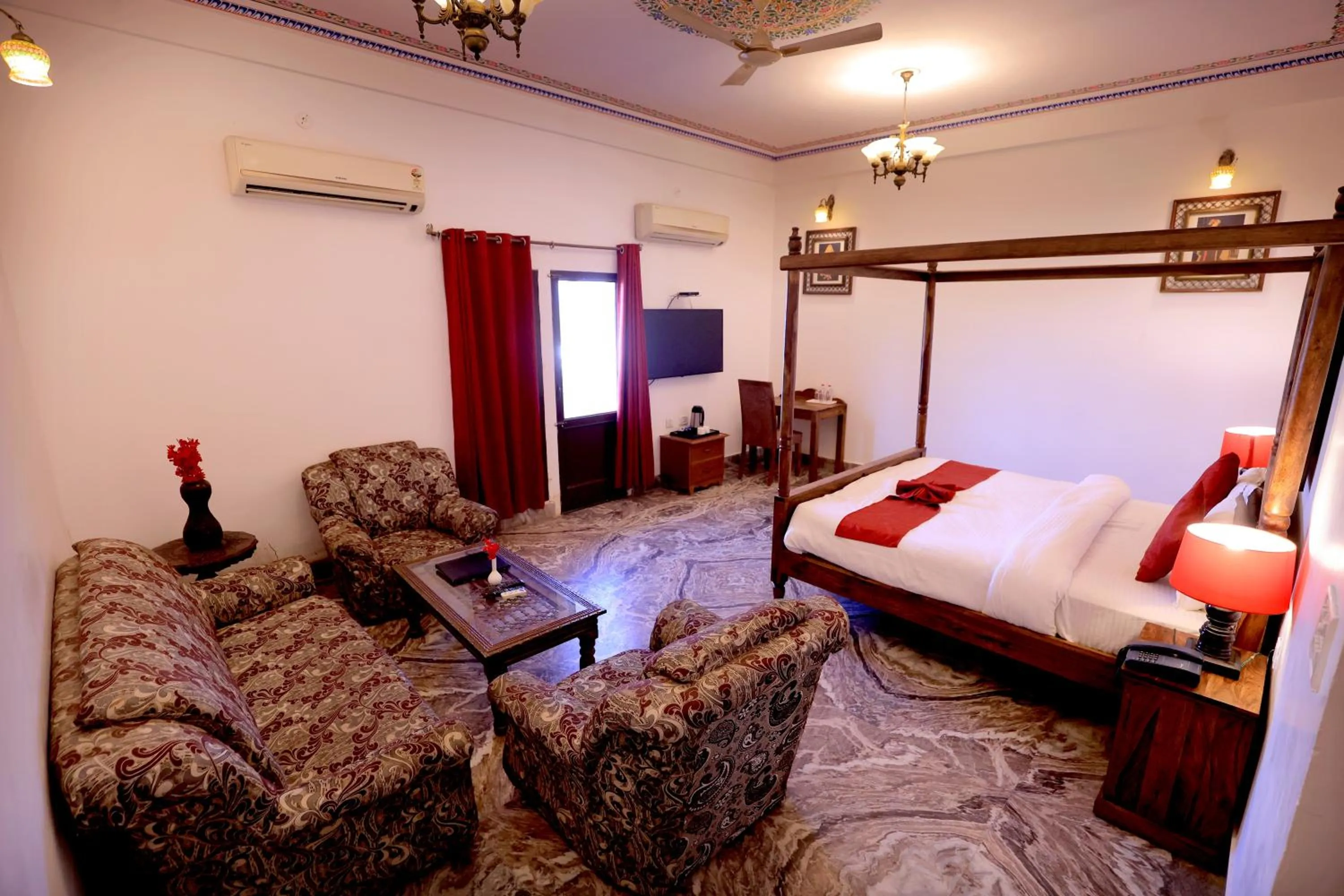 Bed in Satyam Palace Resort