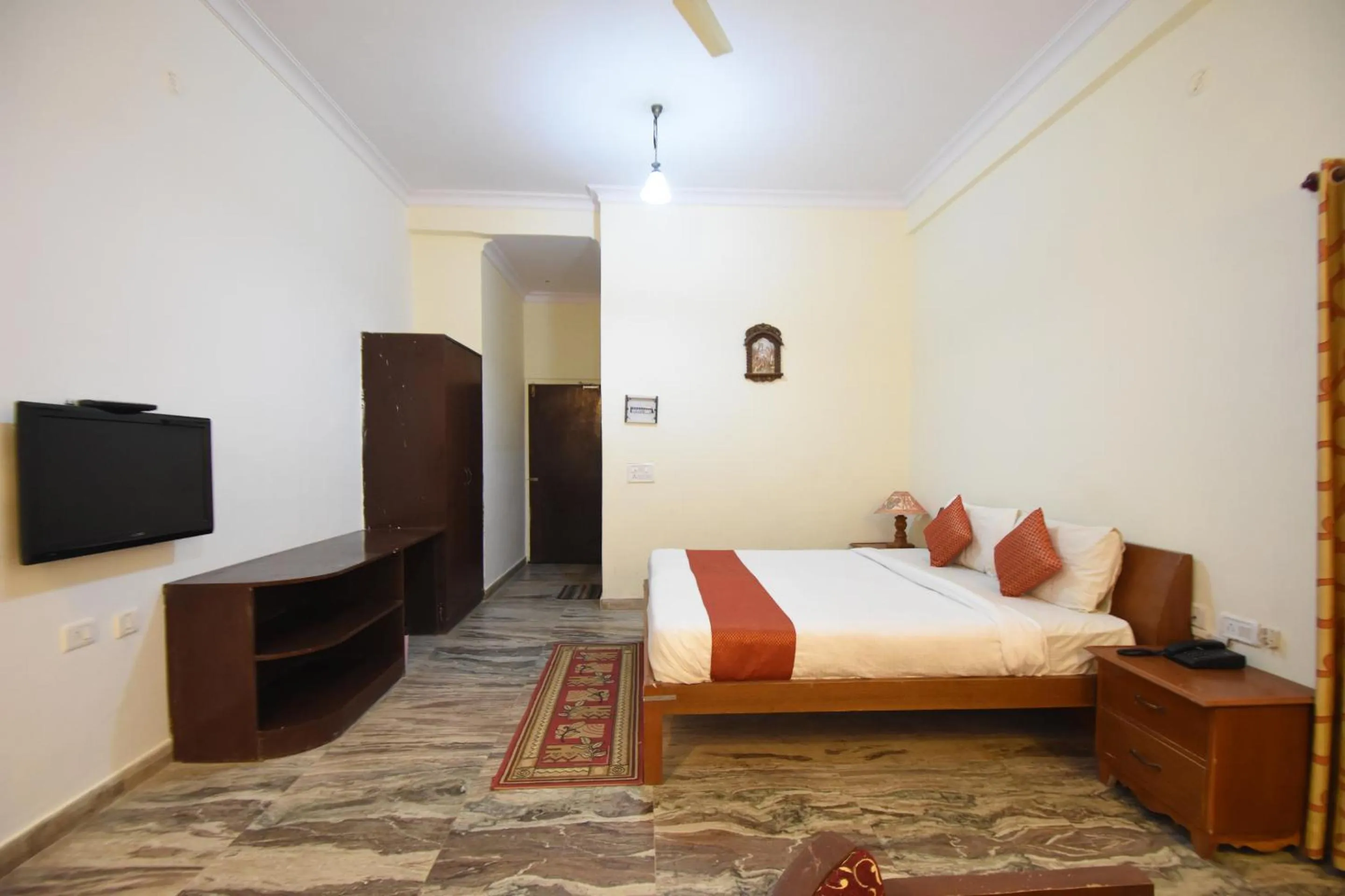 Bed in Satyam Palace Resort