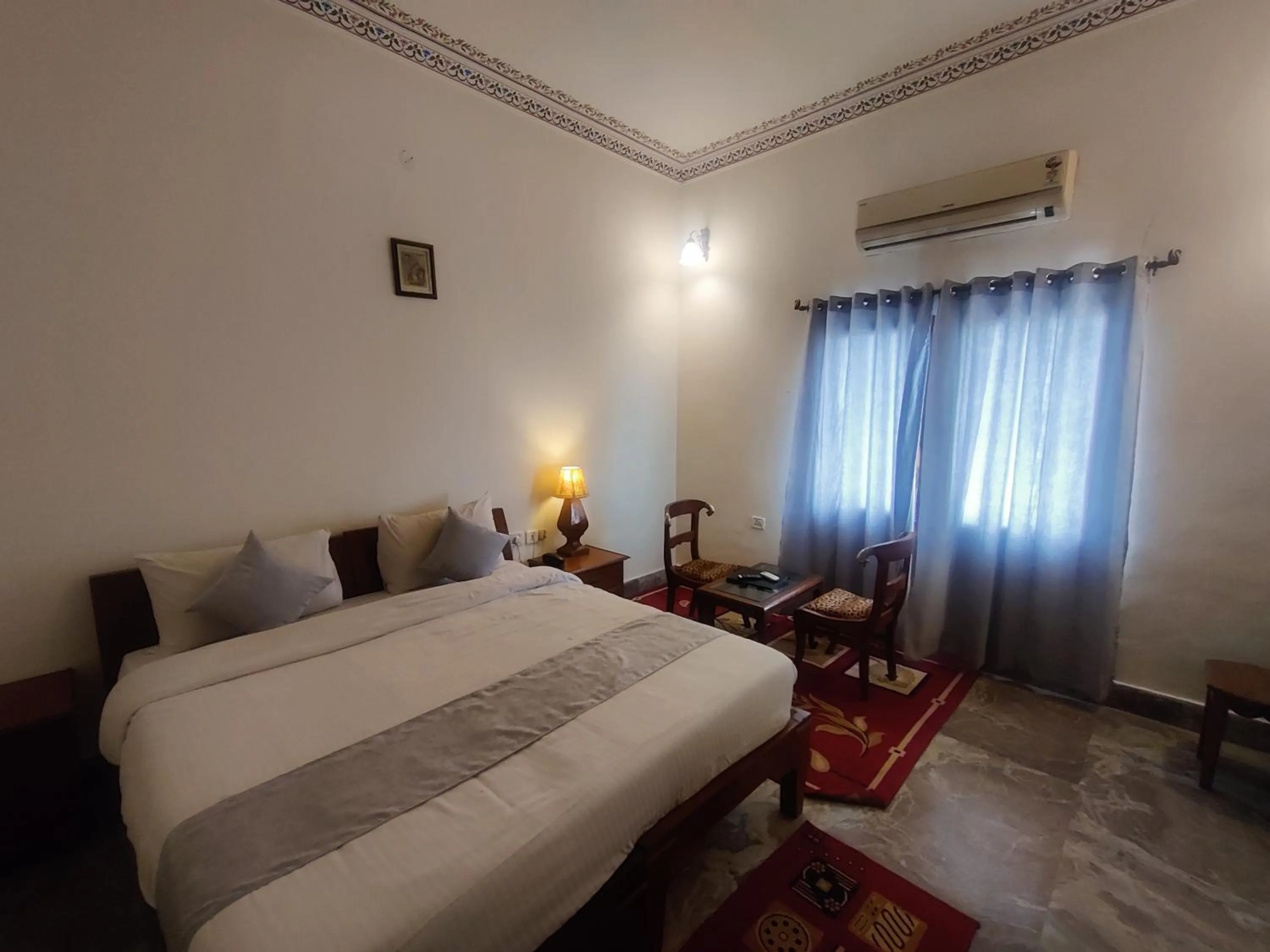 Bed in Satyam Palace Resort