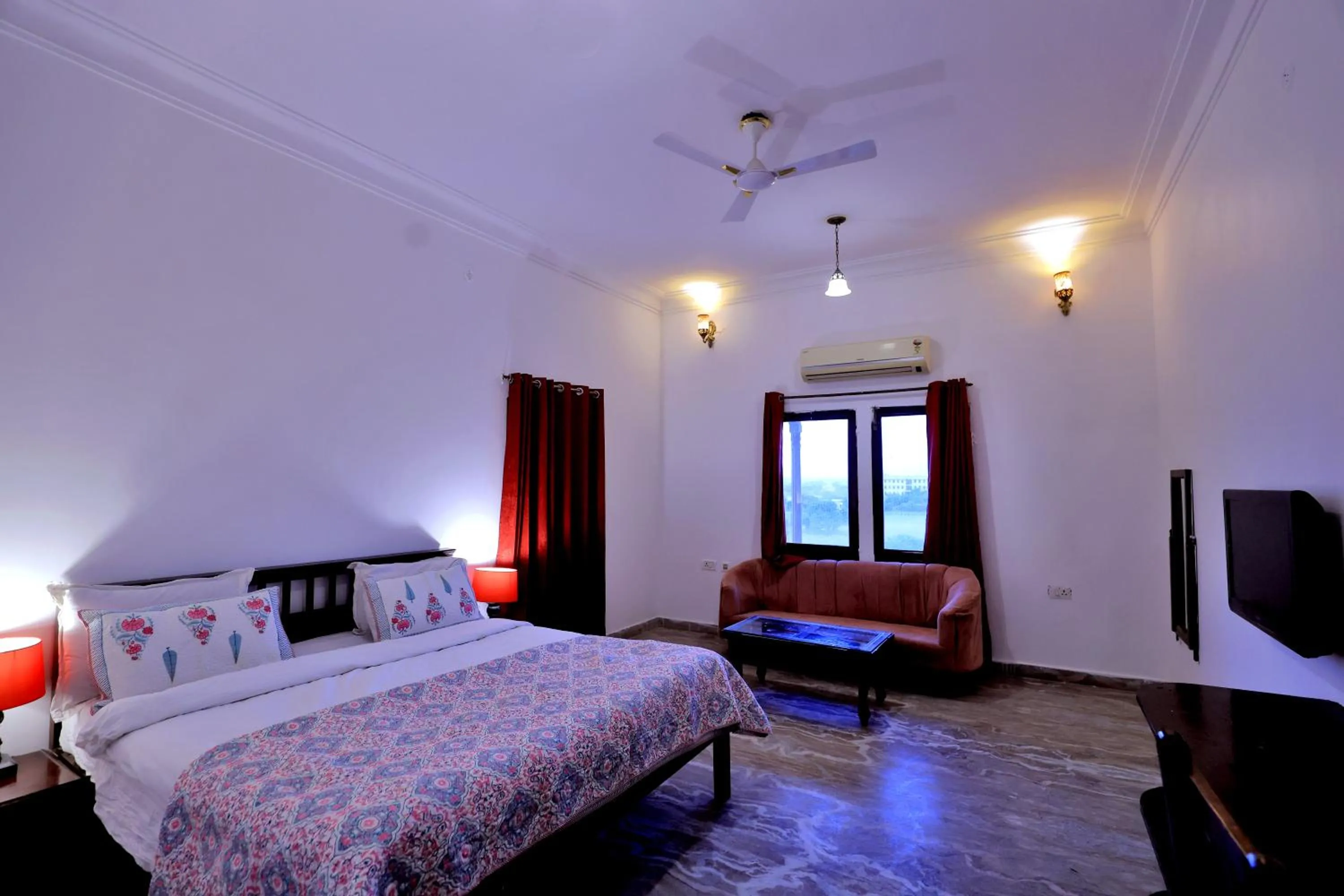 Bed in Satyam Palace Resort