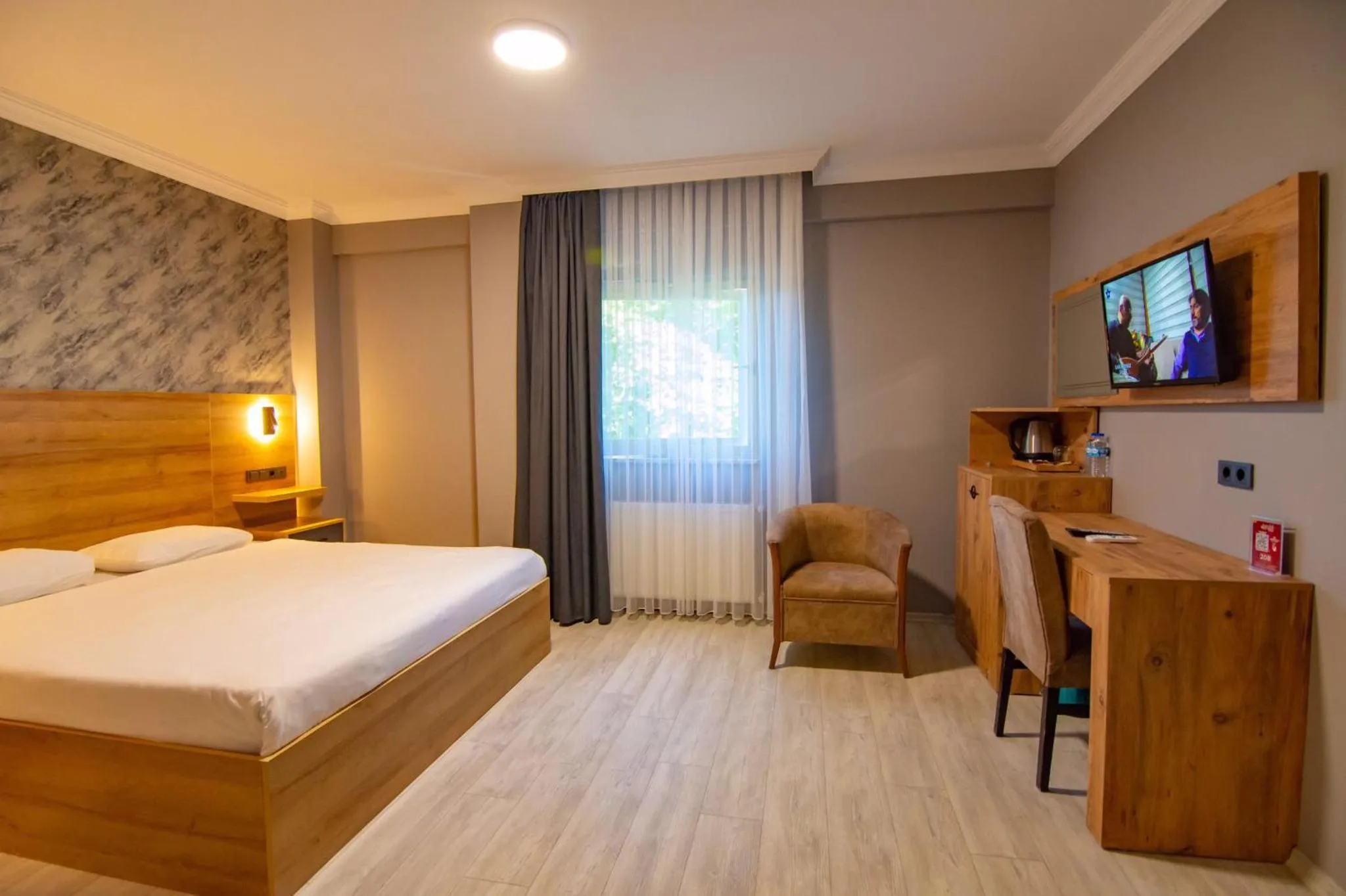 Bed in Green Palace Suite Hotel