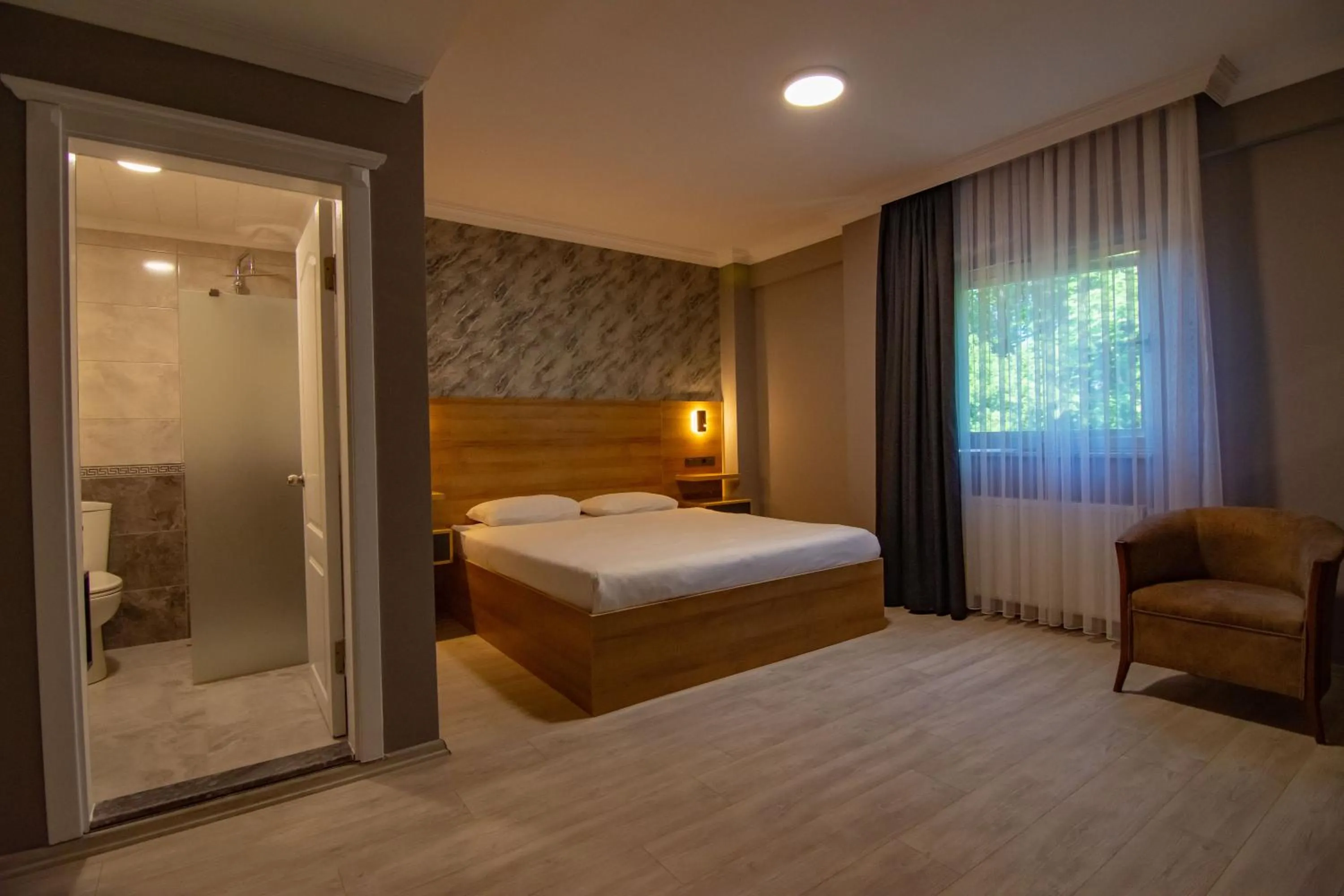 Bed in Green Palace Suite Hotel