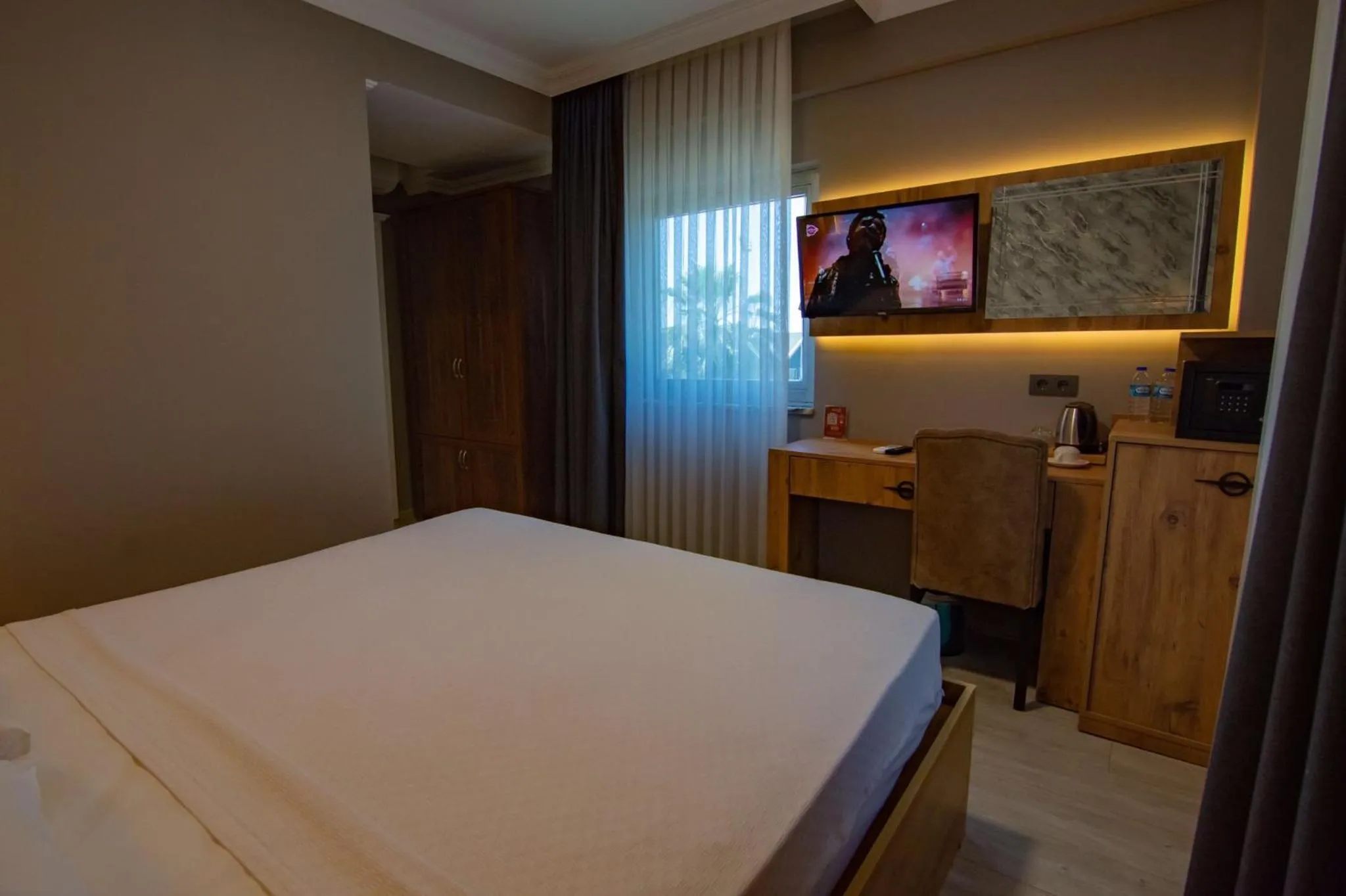 Bed in Green Palace Suite Hotel